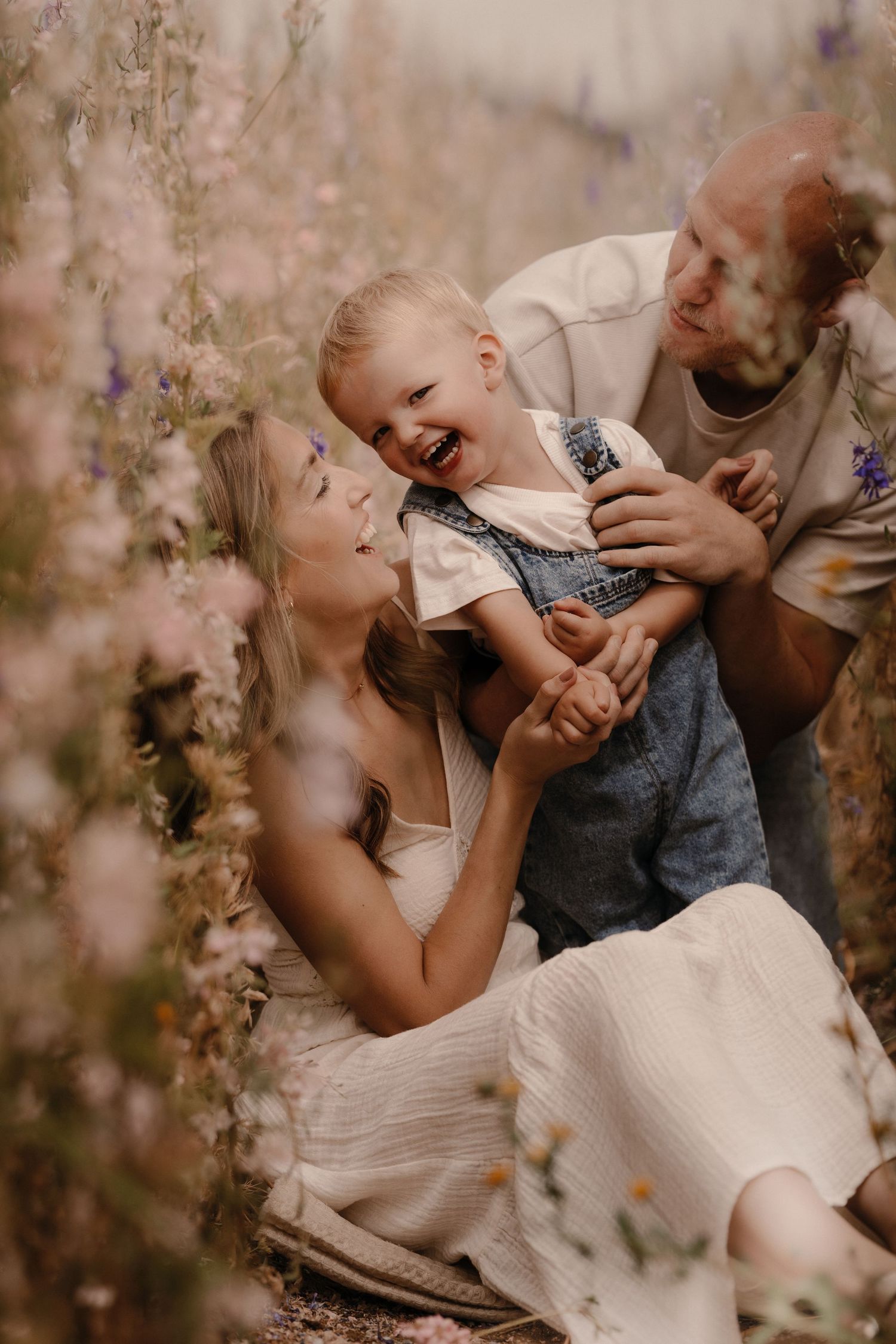 Family session at The Real Flower Petal Confetti Field - family in the delphinium field