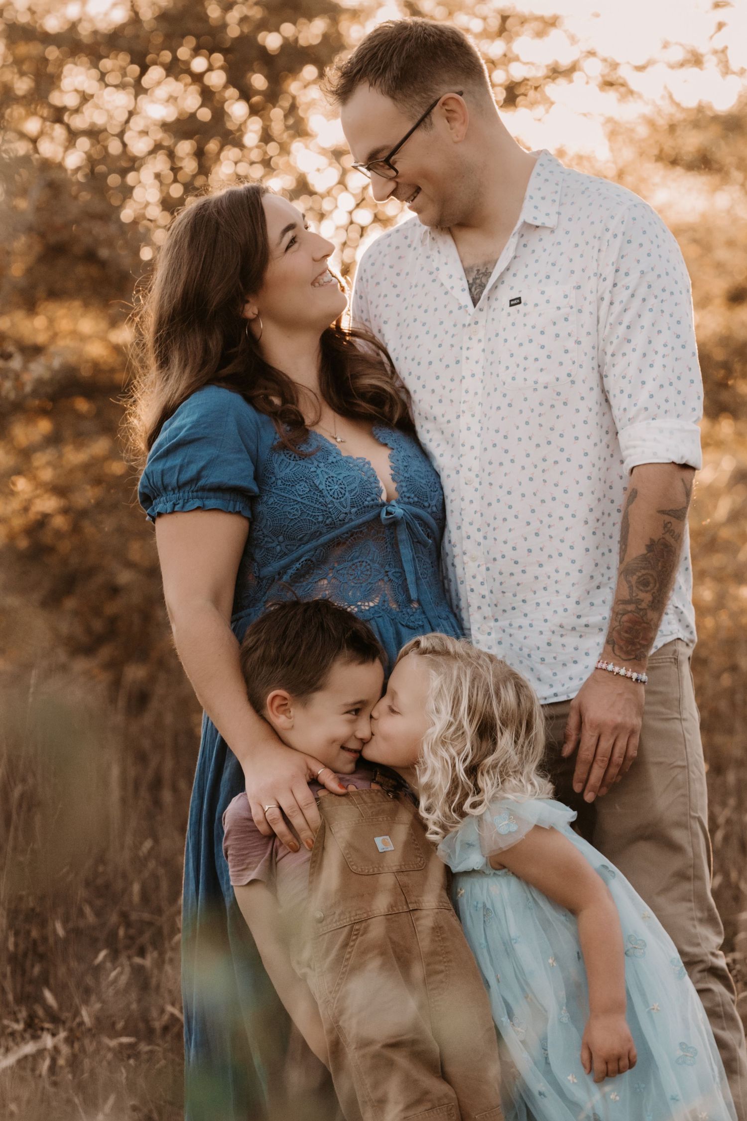 Parents and children hug together in sunset light during a heartfelt storytelling family session in Coalville