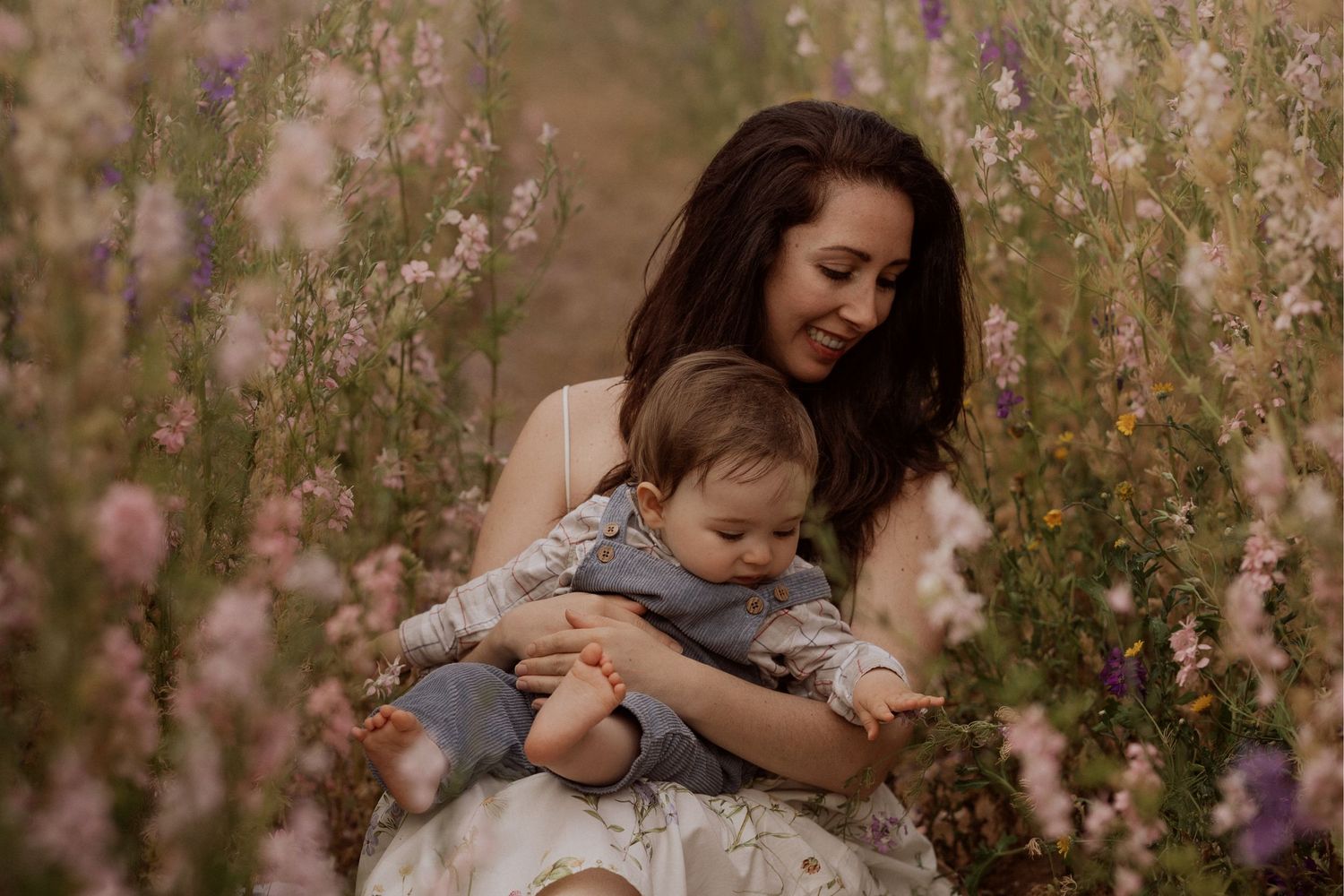 Mum and child laughing in the flower field — Soft Stories by Angela