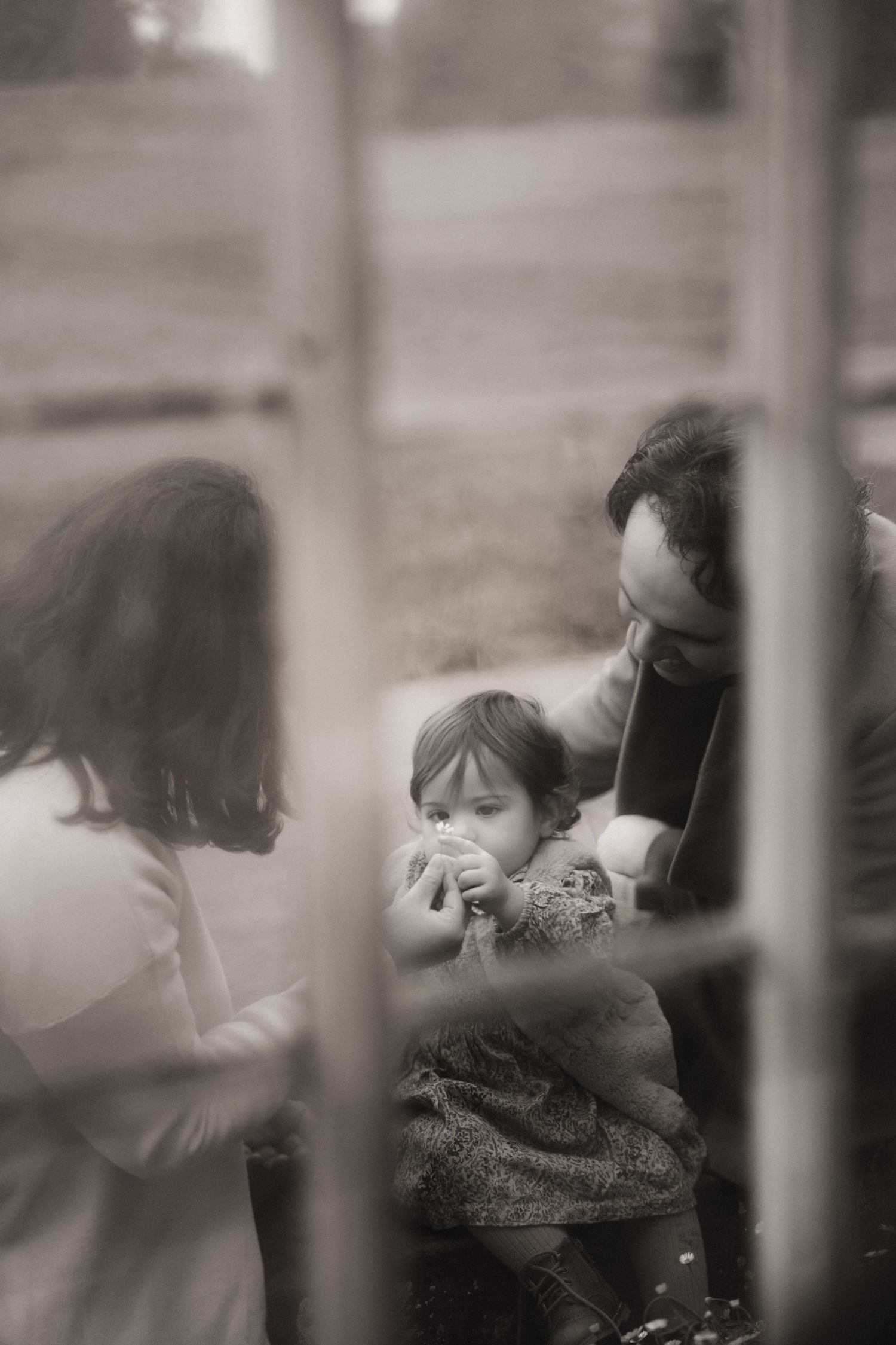 An intimate family moment between parents and daughter during a birthday family photoshoot in Moira