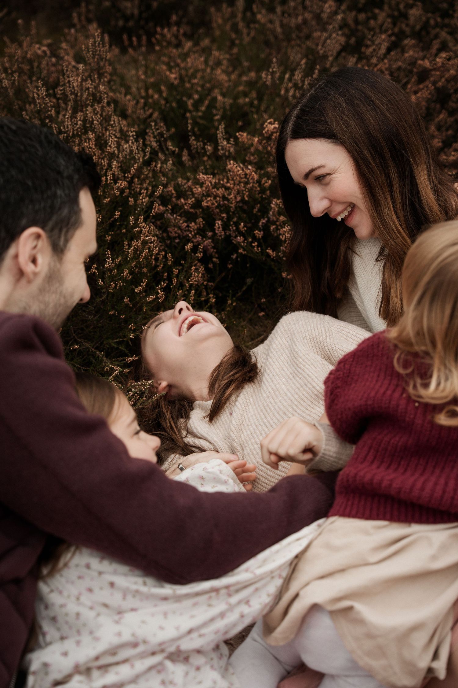 Close up of family moment laughing in heather field in Birmingam