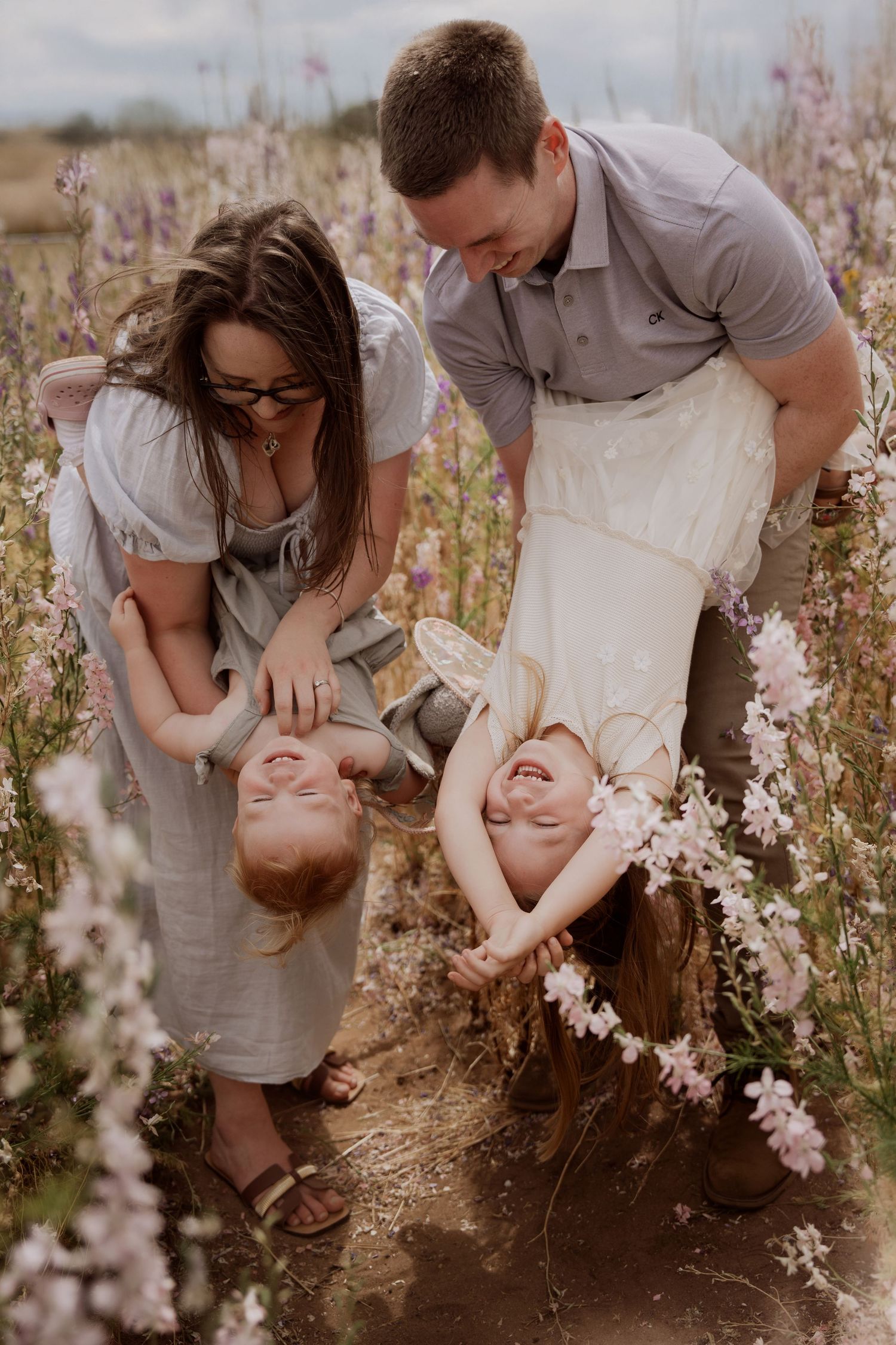 Family session at The Real Flower Petal Confetti Field - family in the delphinium field
