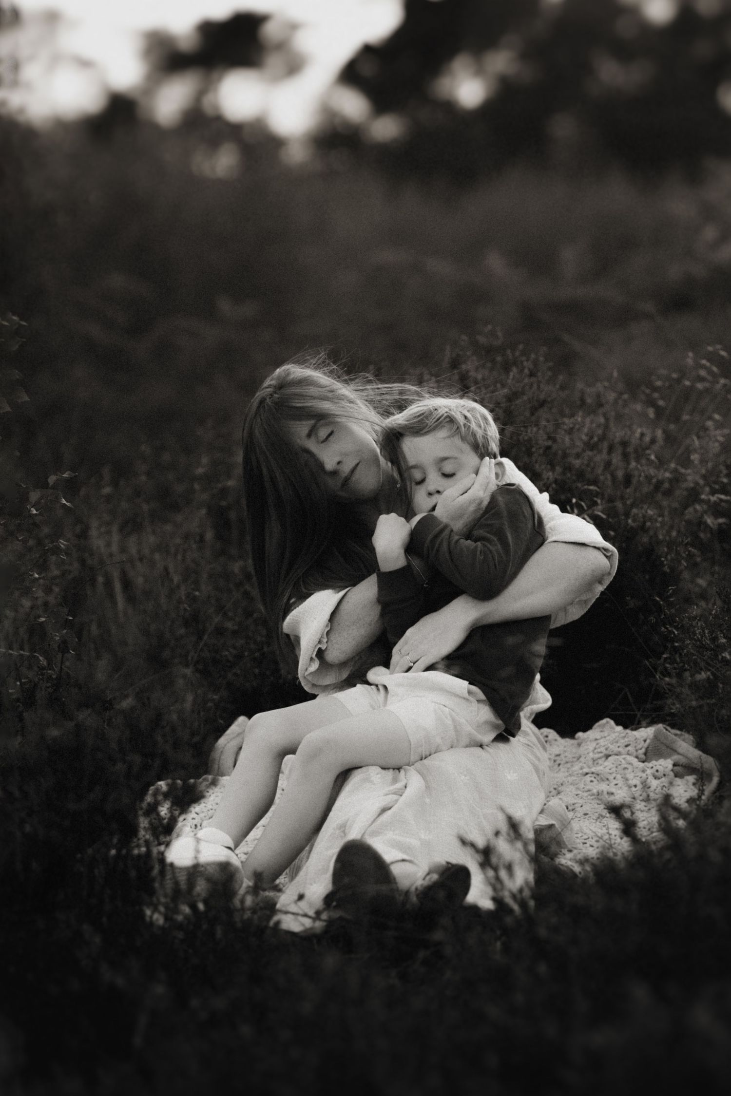 Black-and-white portrait of mother and son wrapped in love – Swadlincote photographer.