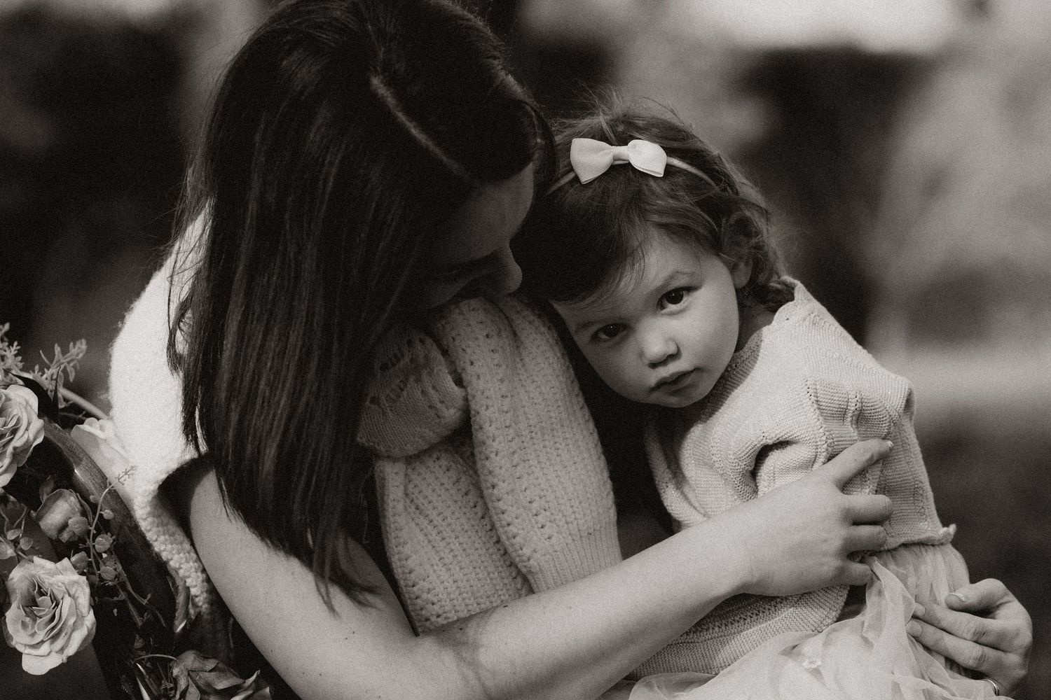 Mum holds her little girl close during an emotional motherhood and connection photography session.