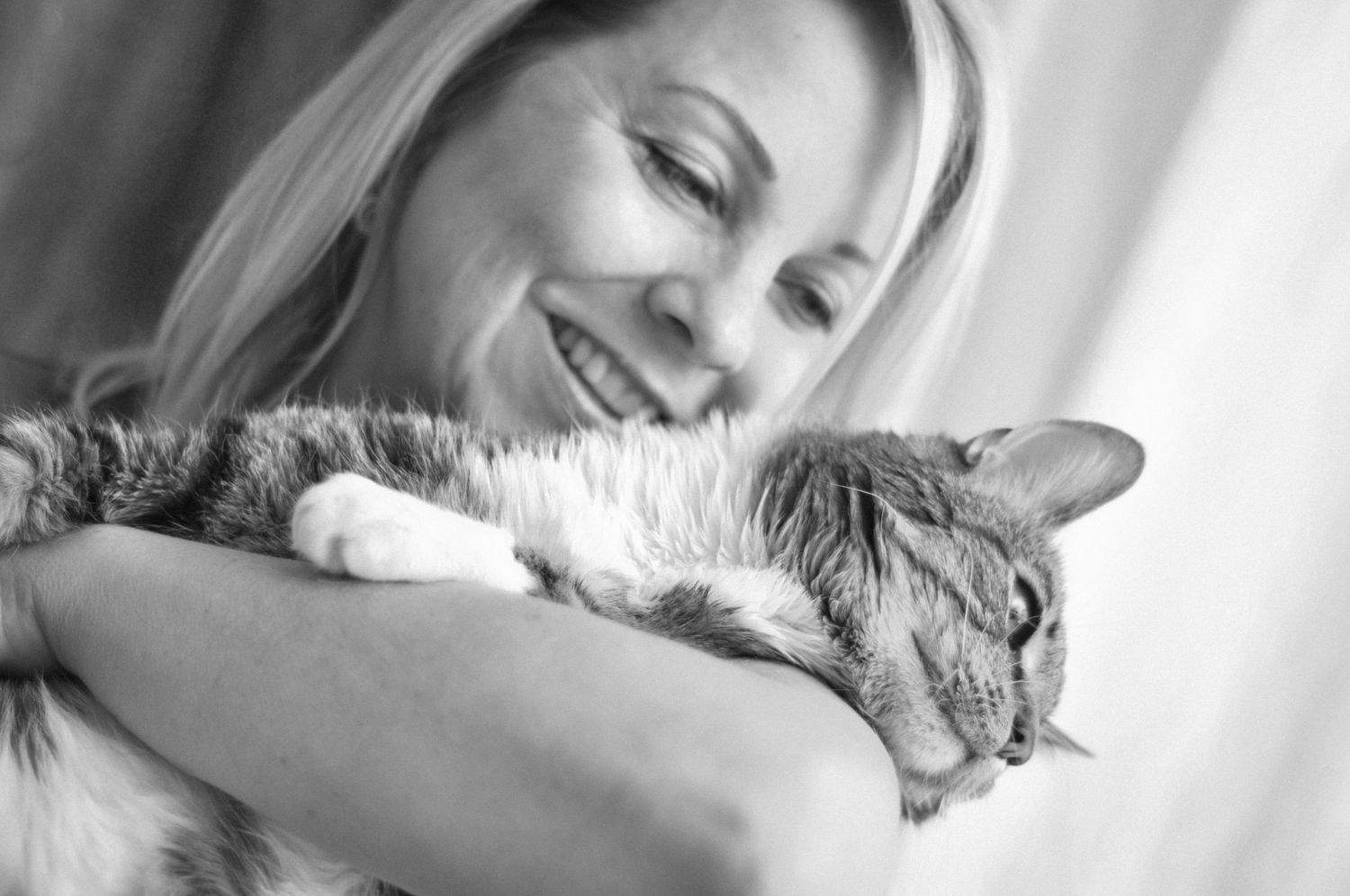 black and white pet photography of a senior cat and it's owner