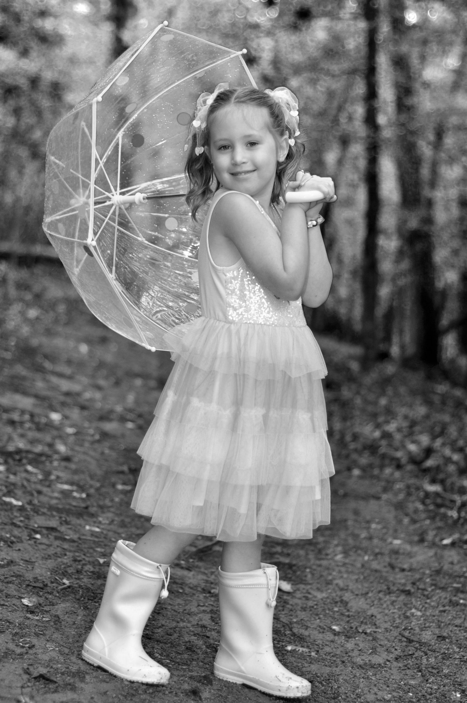 Black and White portrait outside in the rain with an umbrella, children's photography