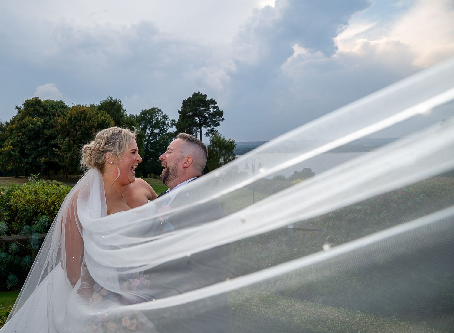 Beautiful Wedding at Rutland Hall Hotel. Wedding Photos by Tudor Rose Photography. Oakham, Rutland. Veil Shot. Couple laughing. Natural.