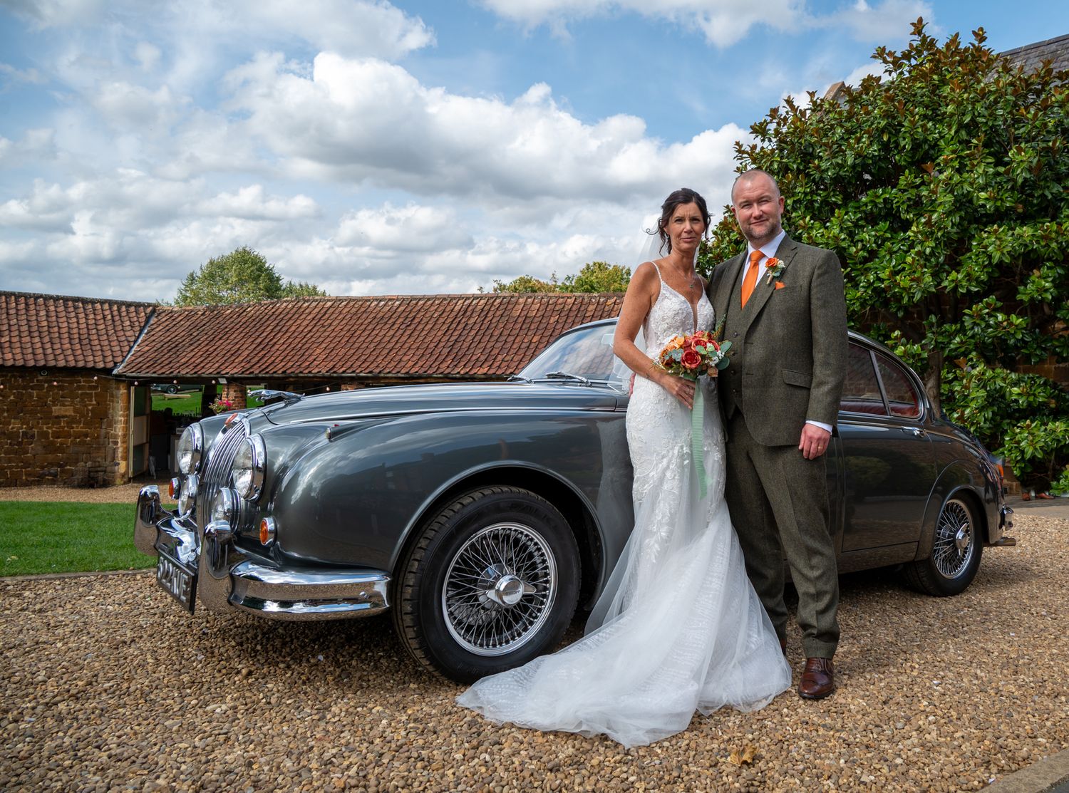 The Barns at Hunsbury Hill. Wedding Photography. Tudor Rose Photography. Couple portrait with classic car