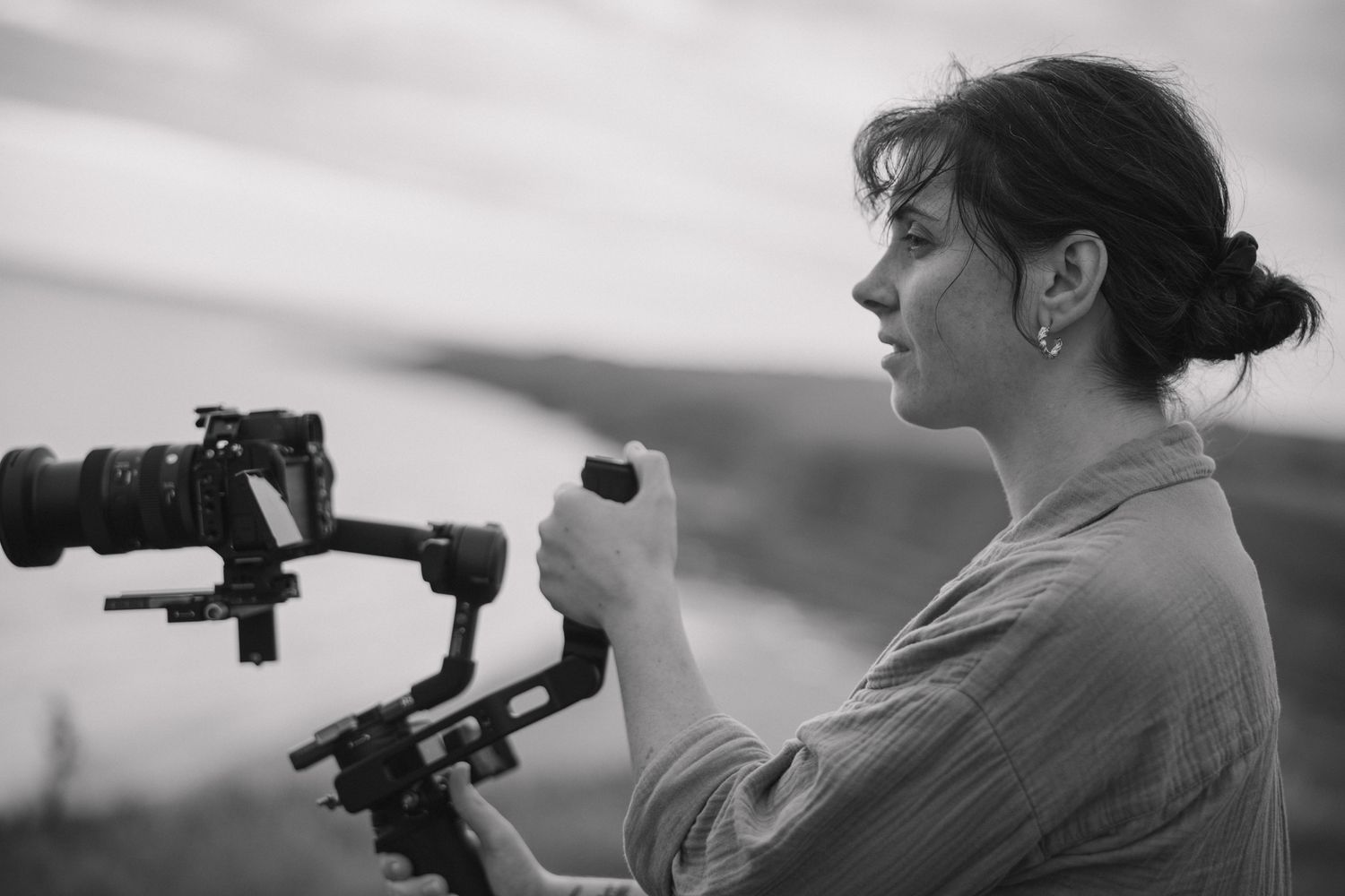 Profile portrait of South Wales Wedding Videographer filming on a Sony A7siii with a Ronin RS3Pro gimbal at Southerndown, Ogmore-by-sea.