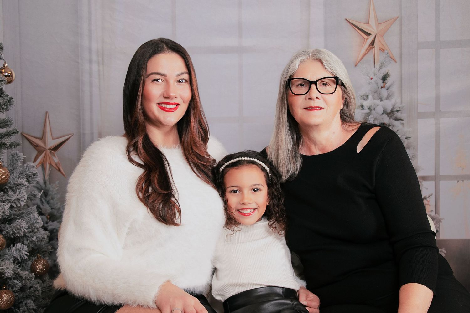 Studio portrait session with copper star decorations and winter theme.