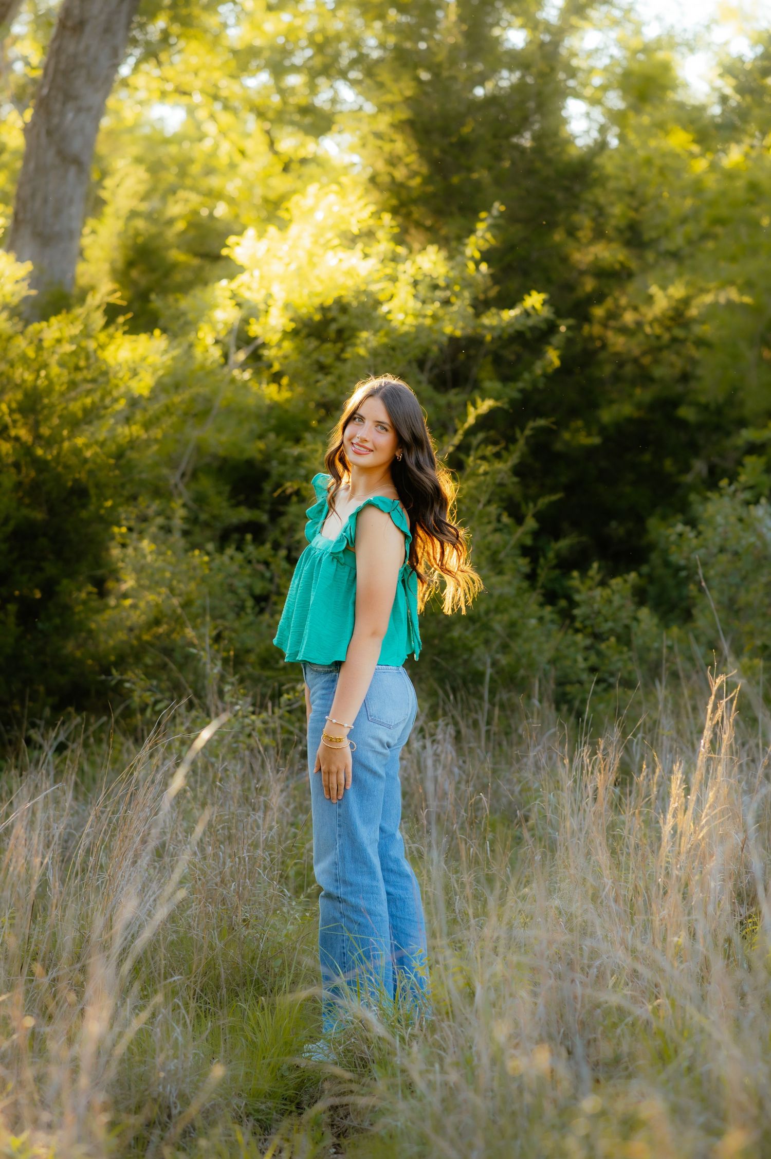 Girl posing for photos with Enid OK senior photographer.