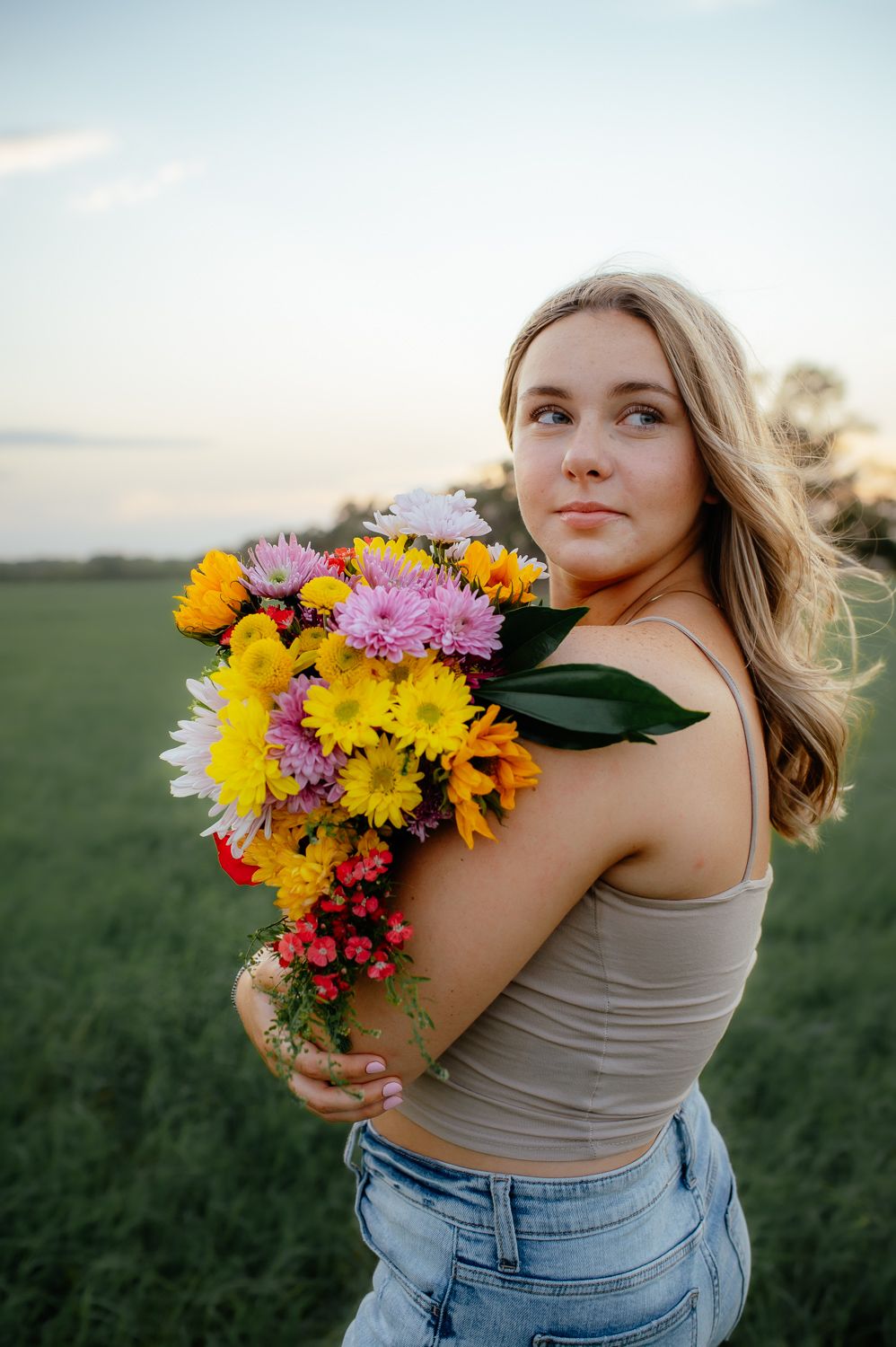 Enid senior posing for a photoshoot with Taryn Elizabeth, an Enid OK Senior Photographer.