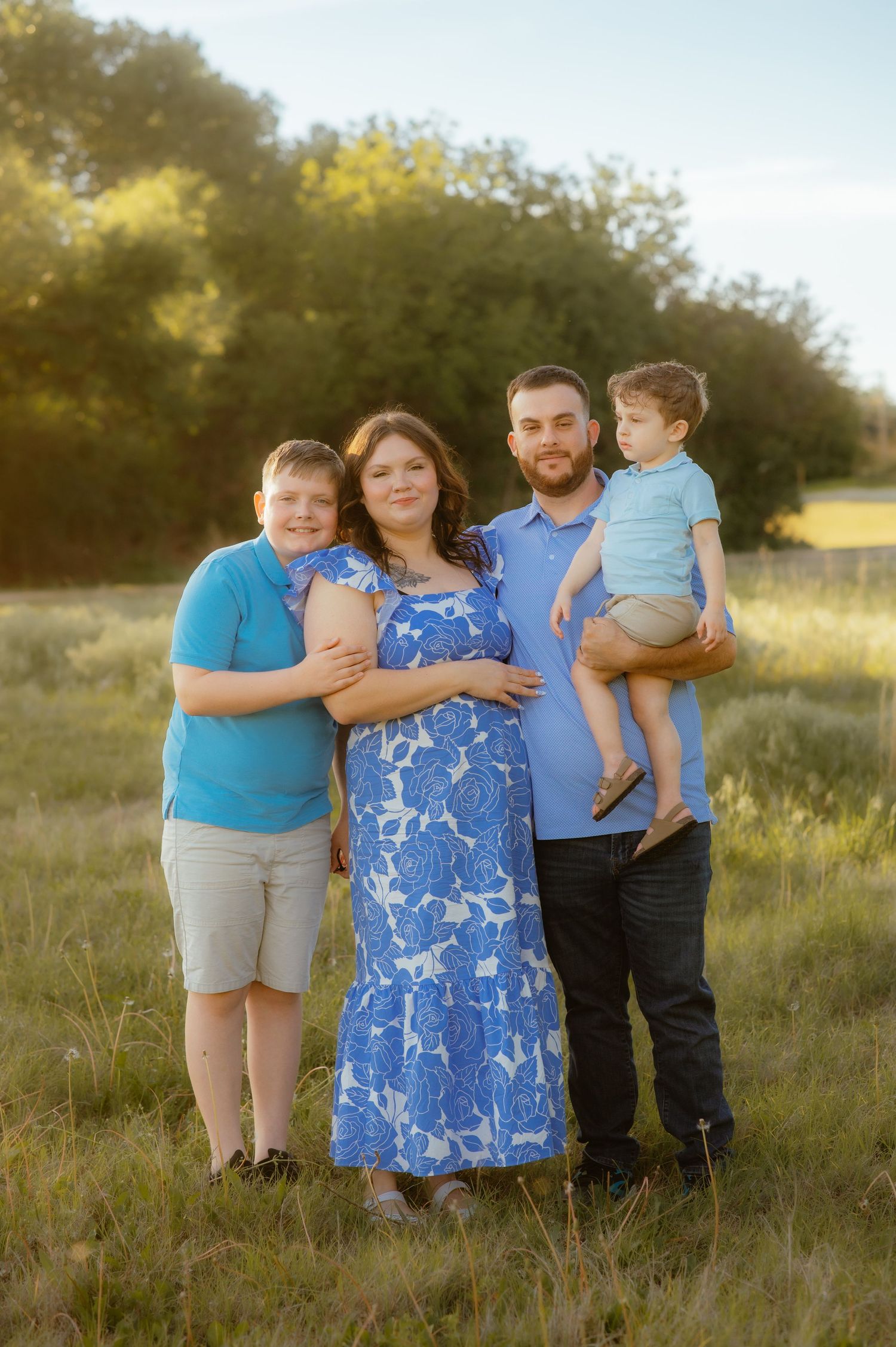 Enid family posing for photos with one of Enid's best photographers.