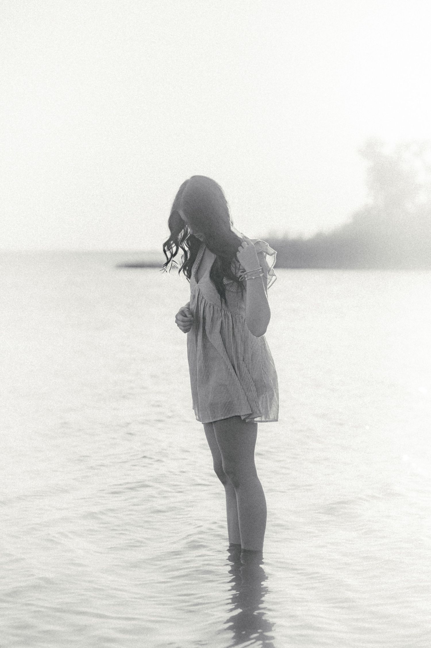 Black and white photo of senior girl captured by Enid OK photographer.