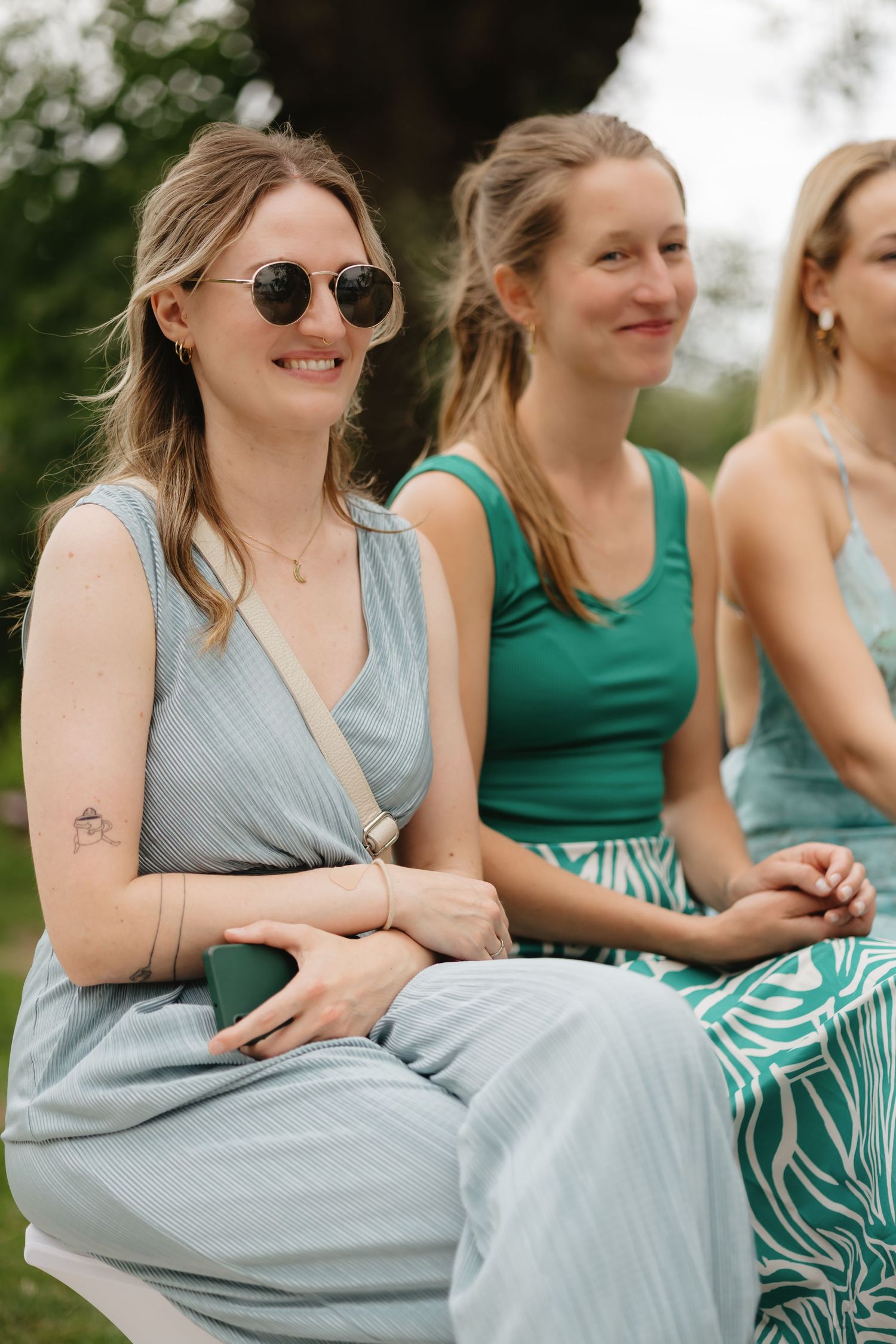 Wedding guests smiling at the wedding ceremony
