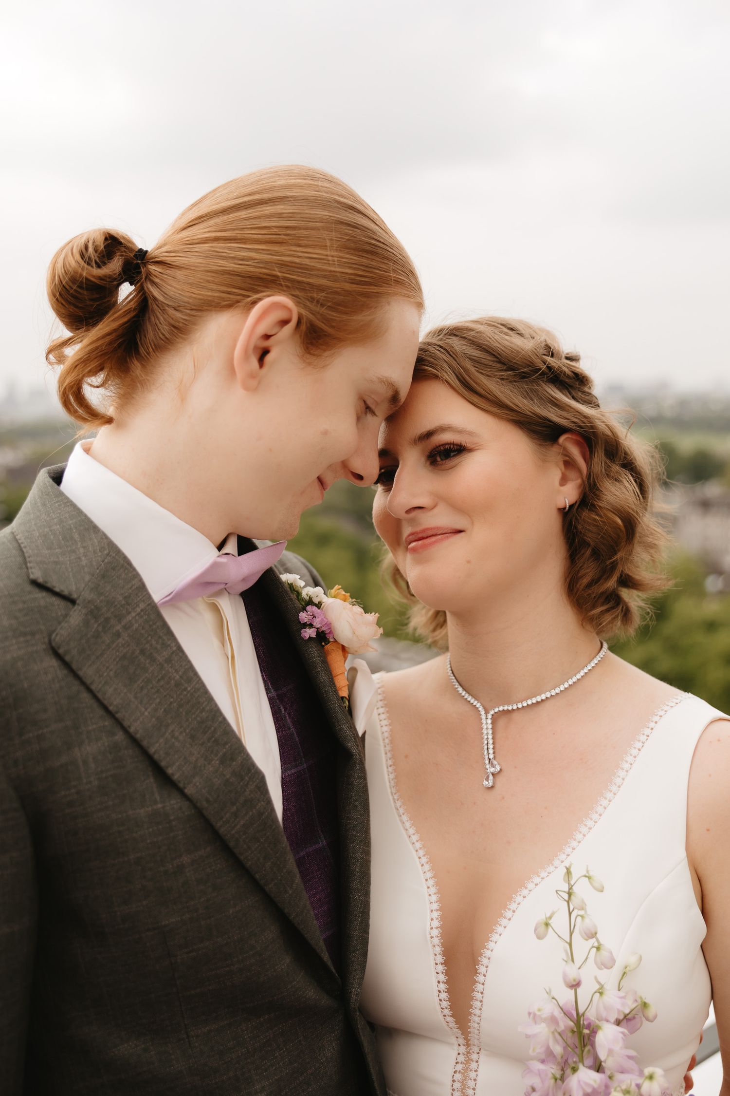 A romantic wedding couple shares an intimate moment against a scenic outdoor backdrop in a four-panel photo series.