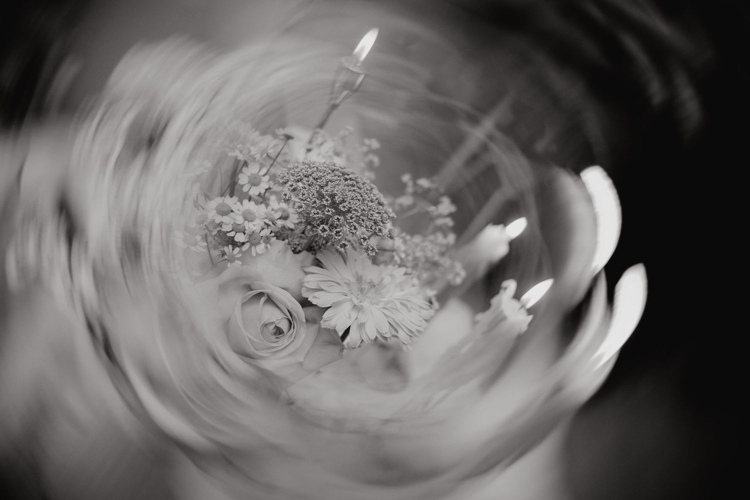 Abstract black and white swirling patterns create a mesmerizing vortex effect in a series of artistic photographs.