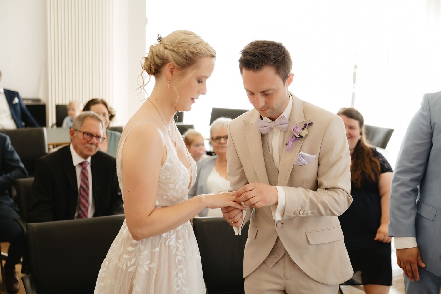 A series of wedding celebration moments showing guests and newlyweds interacting during a reception event.