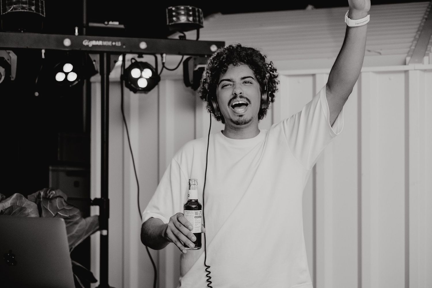 A sequence of black and white photos showing someone in a white t-shirt expressing different emotions and poses.