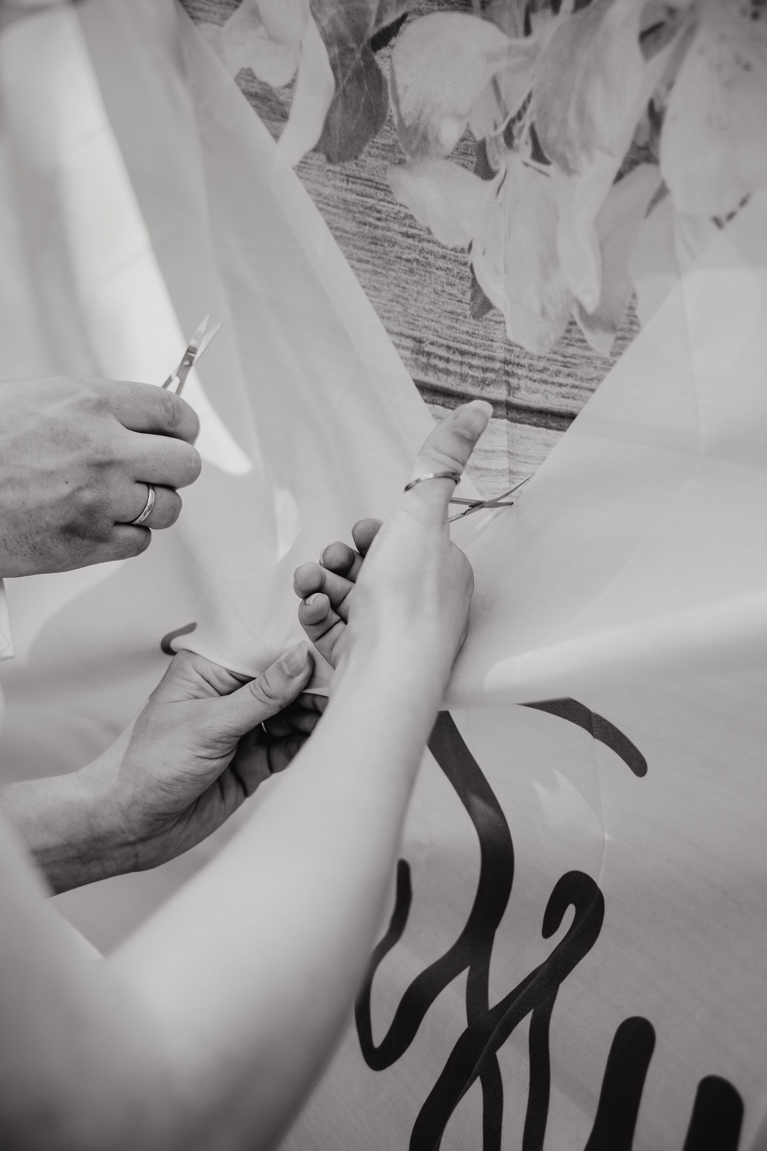 Close-up sequence showing hands writing black text on white paper.