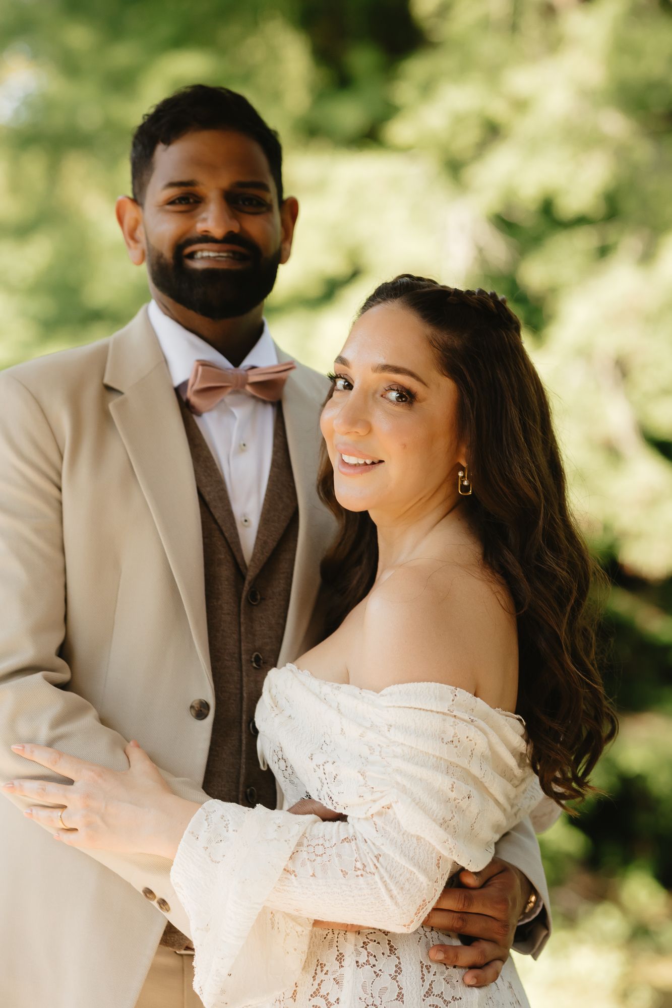 Candid wedding photos showing joyful laughter between couple in outdoor setting.
