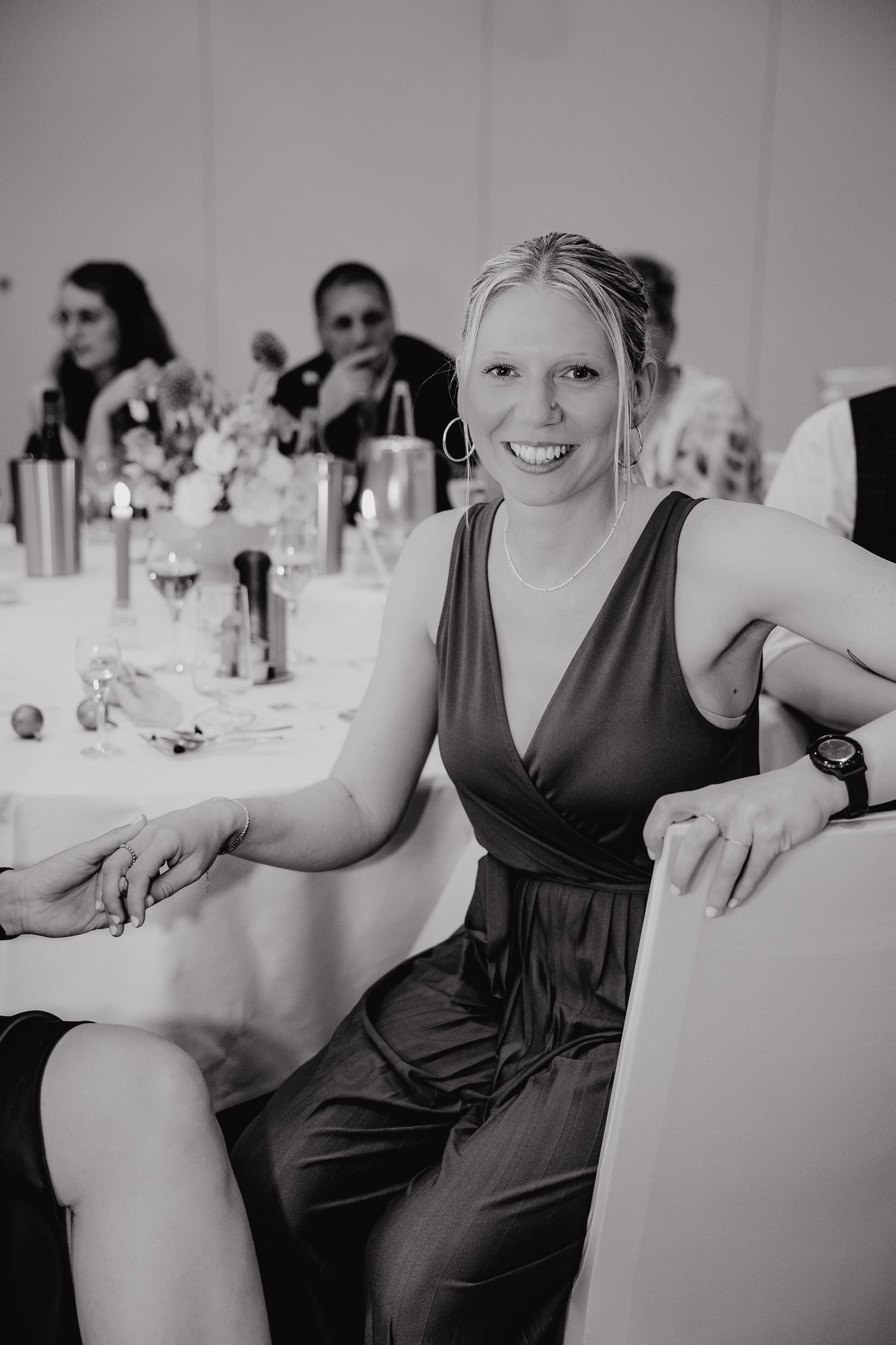A sequence of black and white photos showing people dancing and celebrating at a formal event.