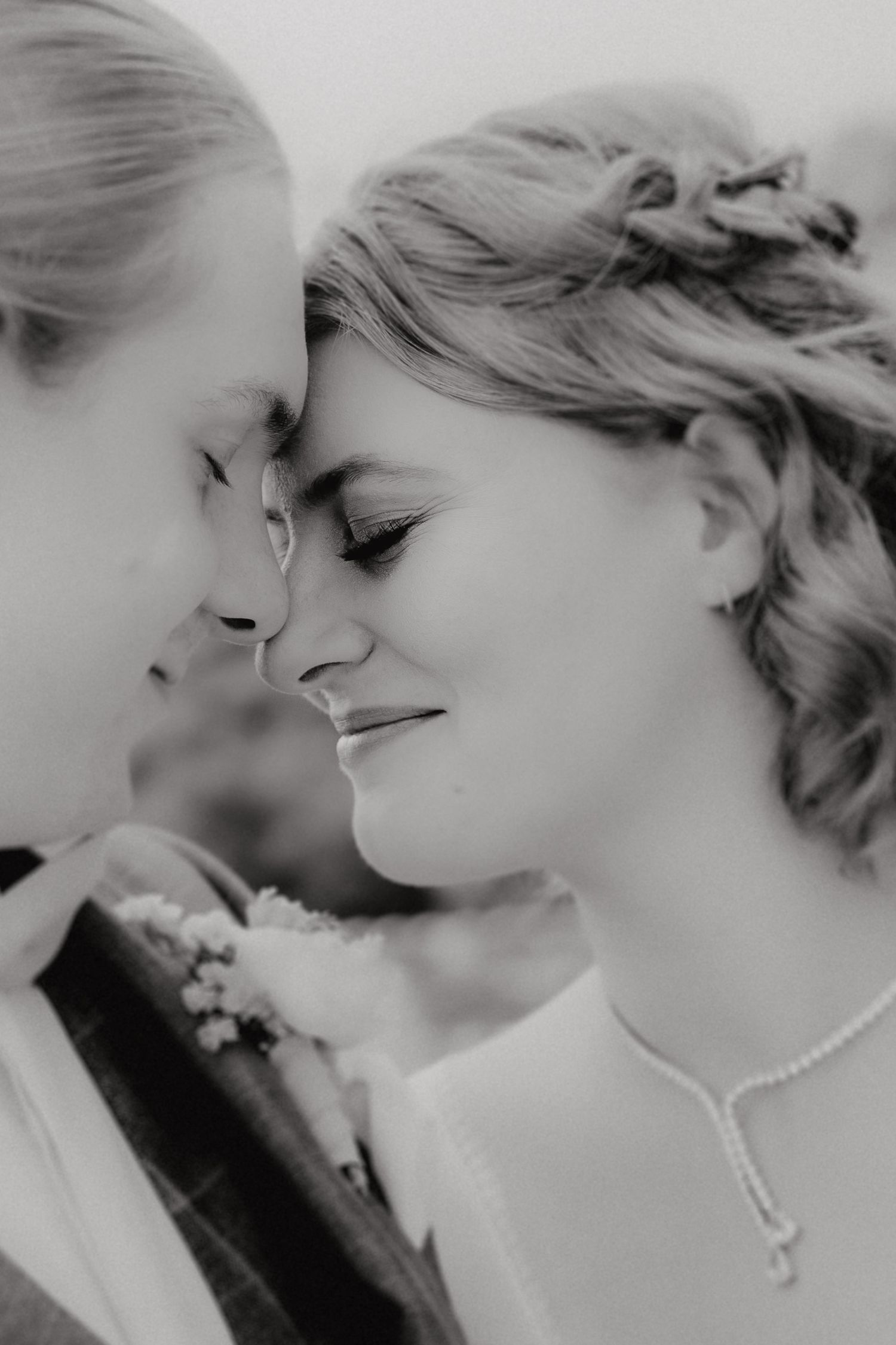 Black and white romantic wedding photo sequence showing tender moments between newlyweds in an artistic style.