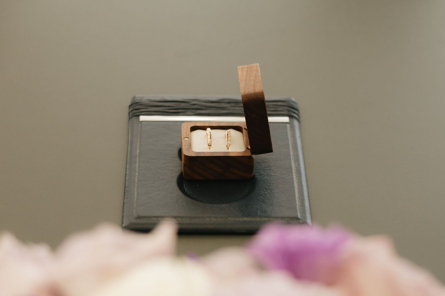 A chocolate bar with marshmallow filling is cut into sections revealing the fluffy white interior against a dark background.