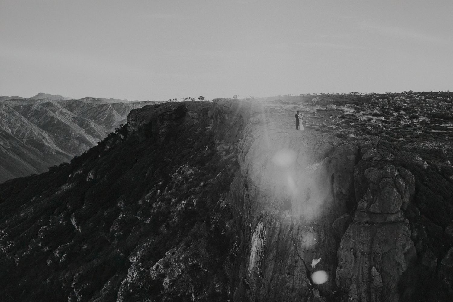 Bride and Groom standing at the top of Shothole Canyon within Cape Range National Park, photograph is taken from a helicopter