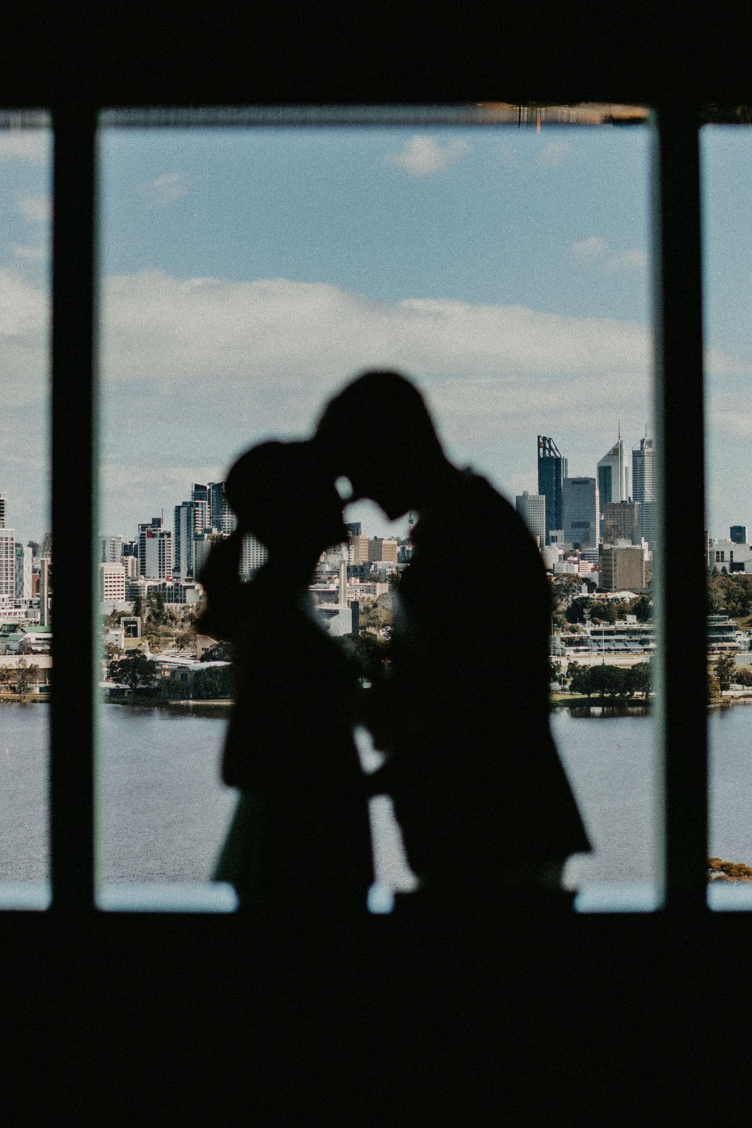 Bride and Groom silhouette against Perth City Skyline from Crown Towers Hotel