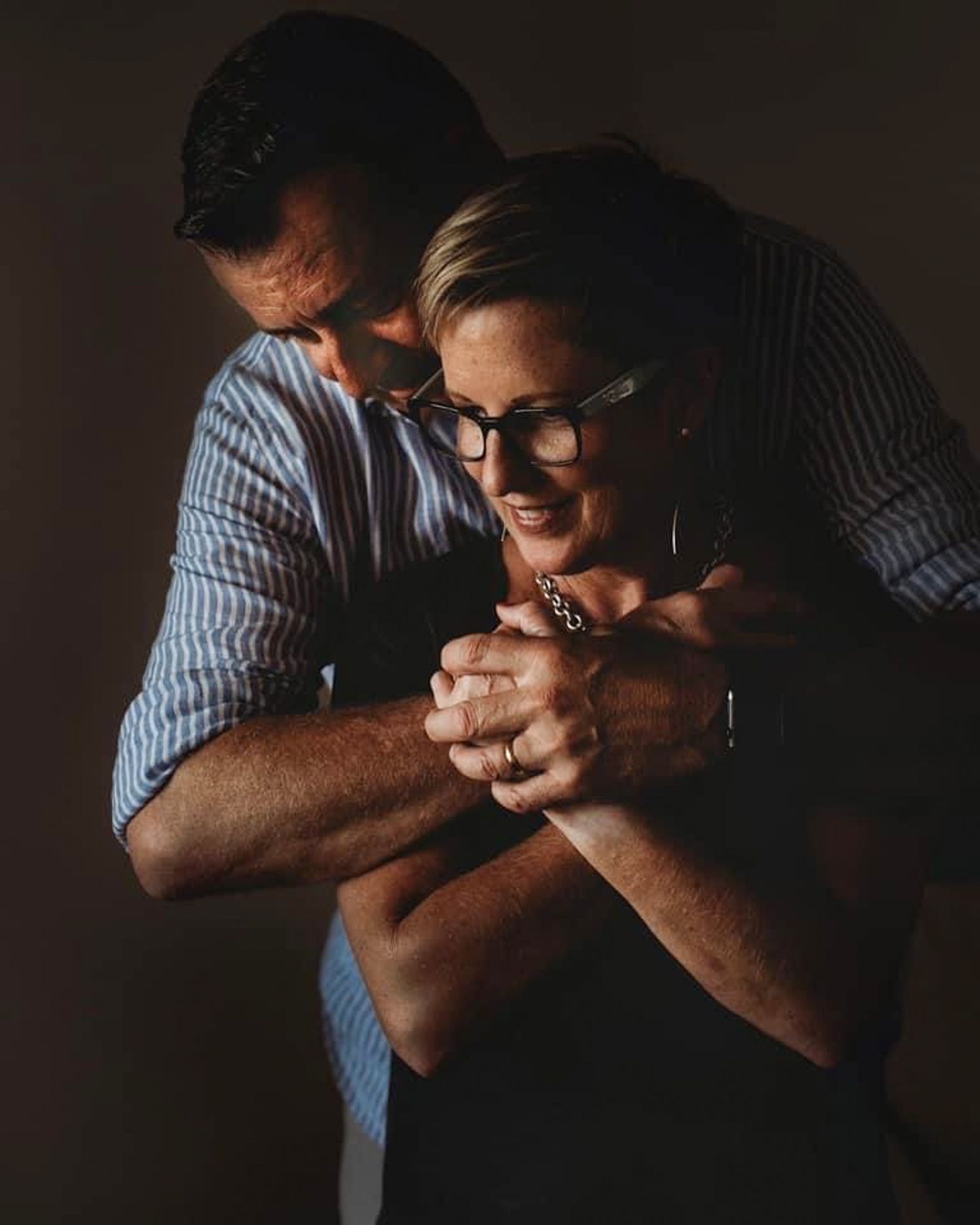 Cat and husband sharing a quiet moment during an intimate portrait session in Western Australia