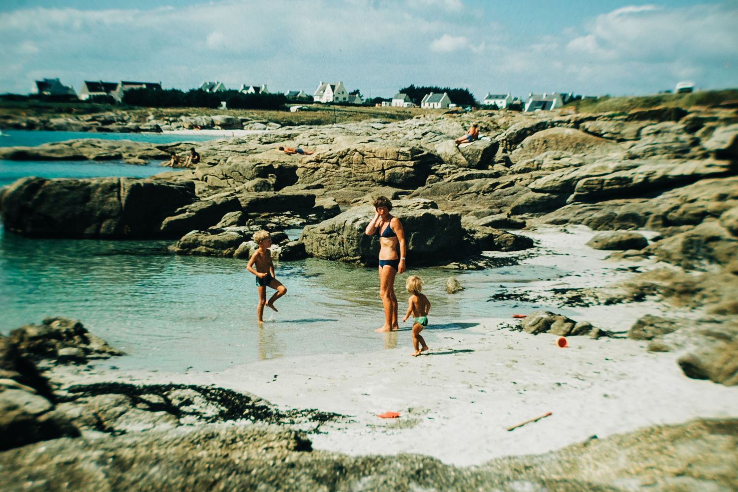 Cat aged two with her mum and brother during a family holiday on the French coast