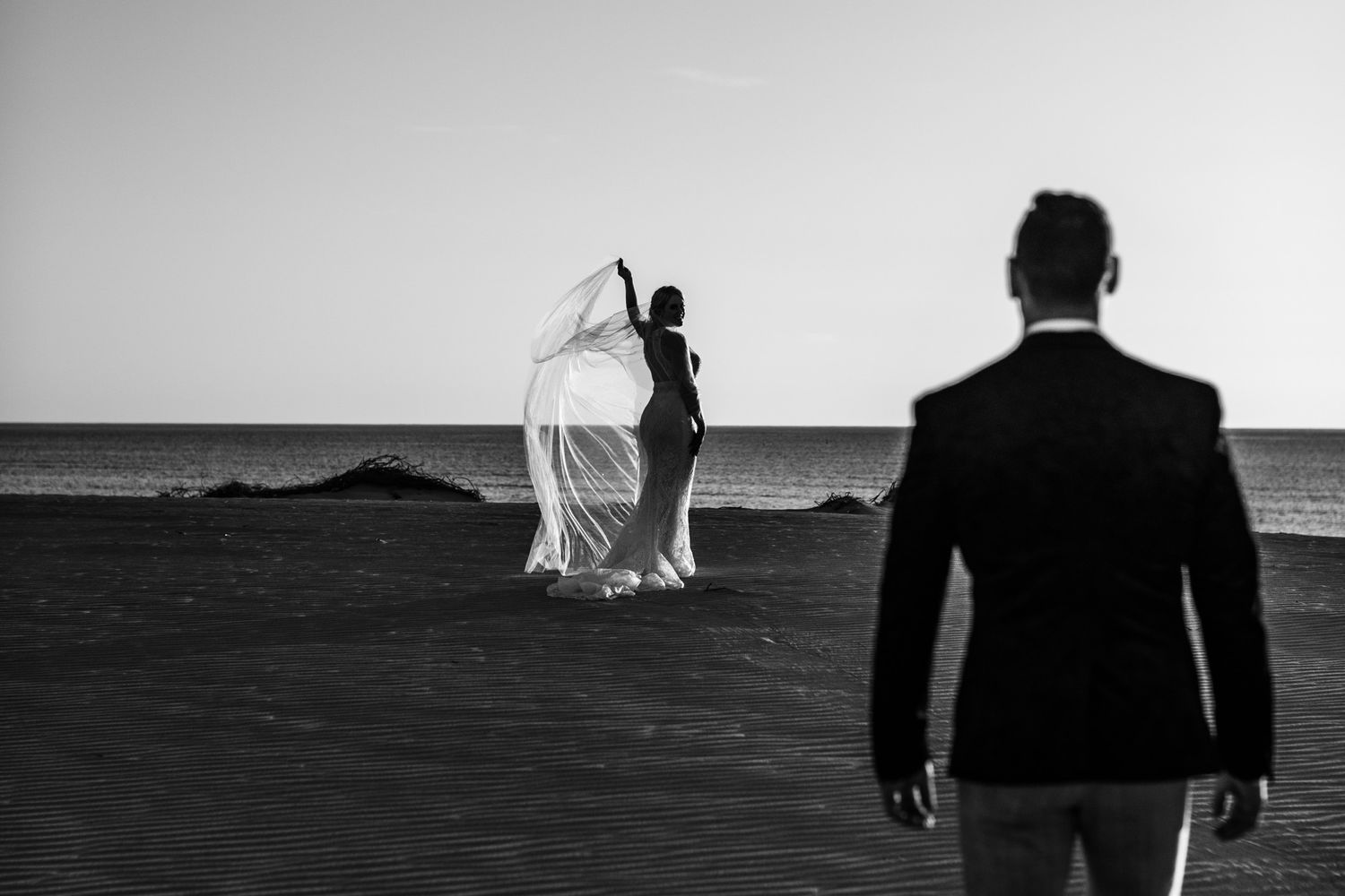 Bride and groom elopement portrait photos on large sand dunes located near to Exmouth, WA