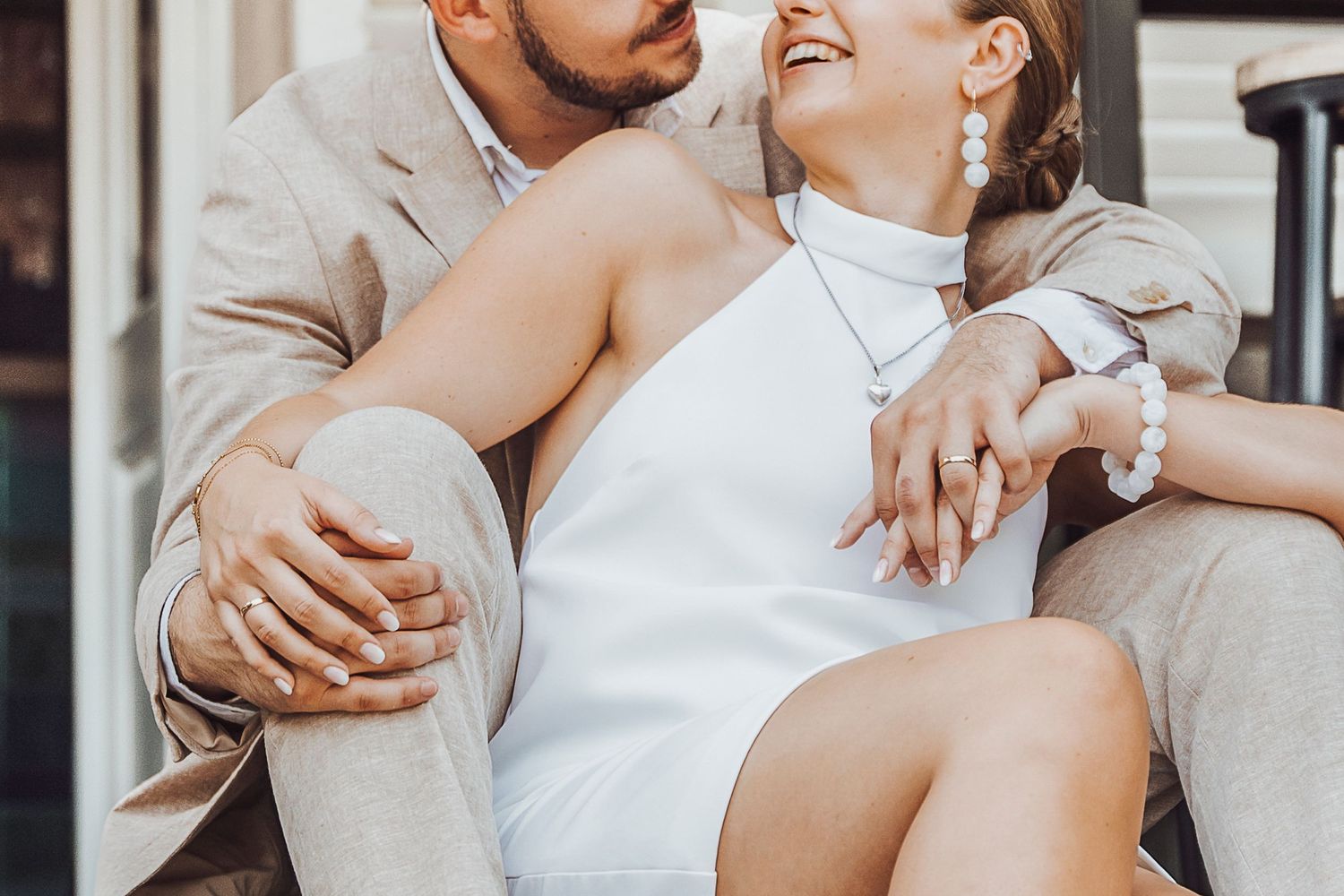Close-up shot of couple in formal attire sharing a tender moment.