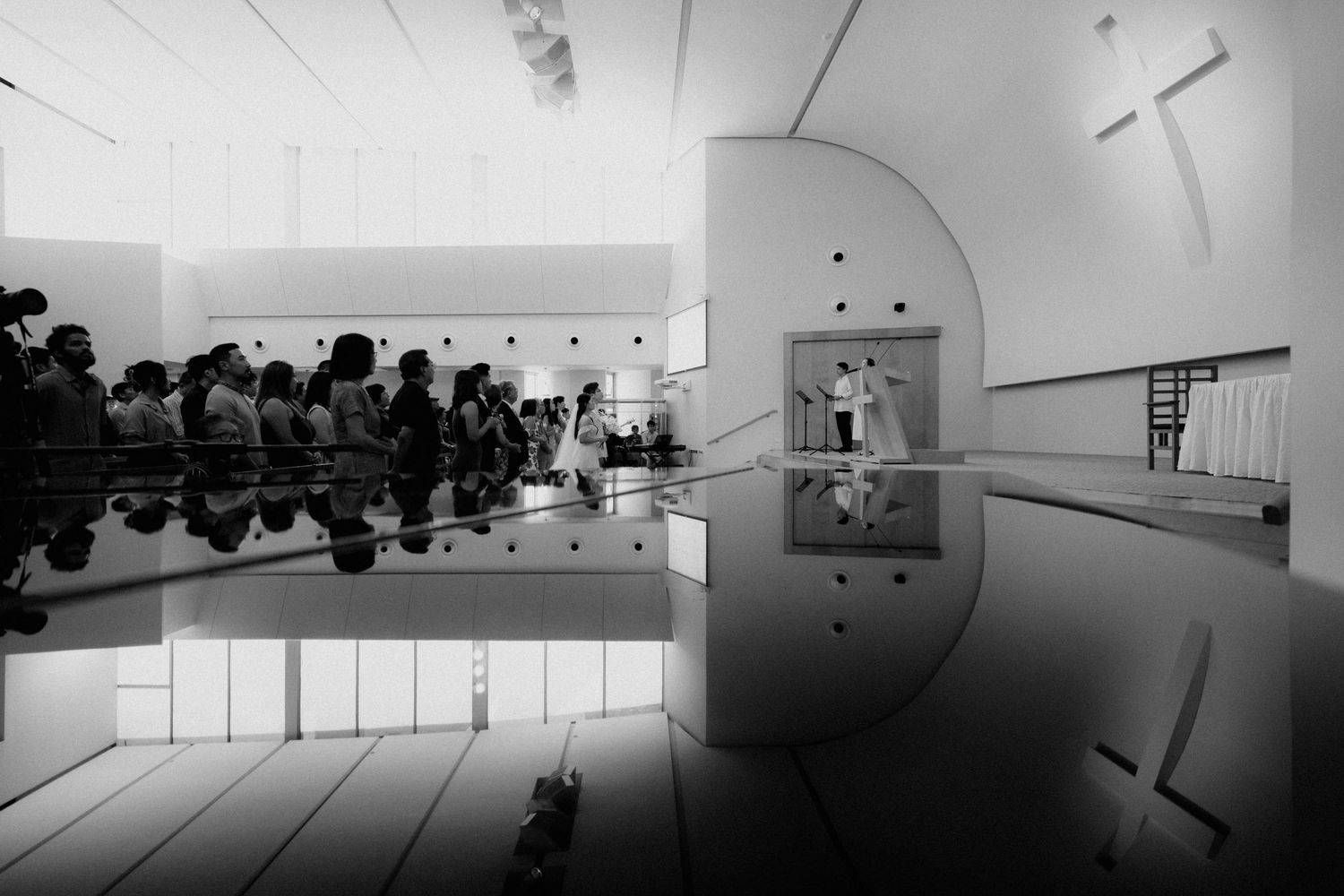 A montage of minimalist art gallery interior spaces with white walls, lighting fixtures, and various mounted displays.