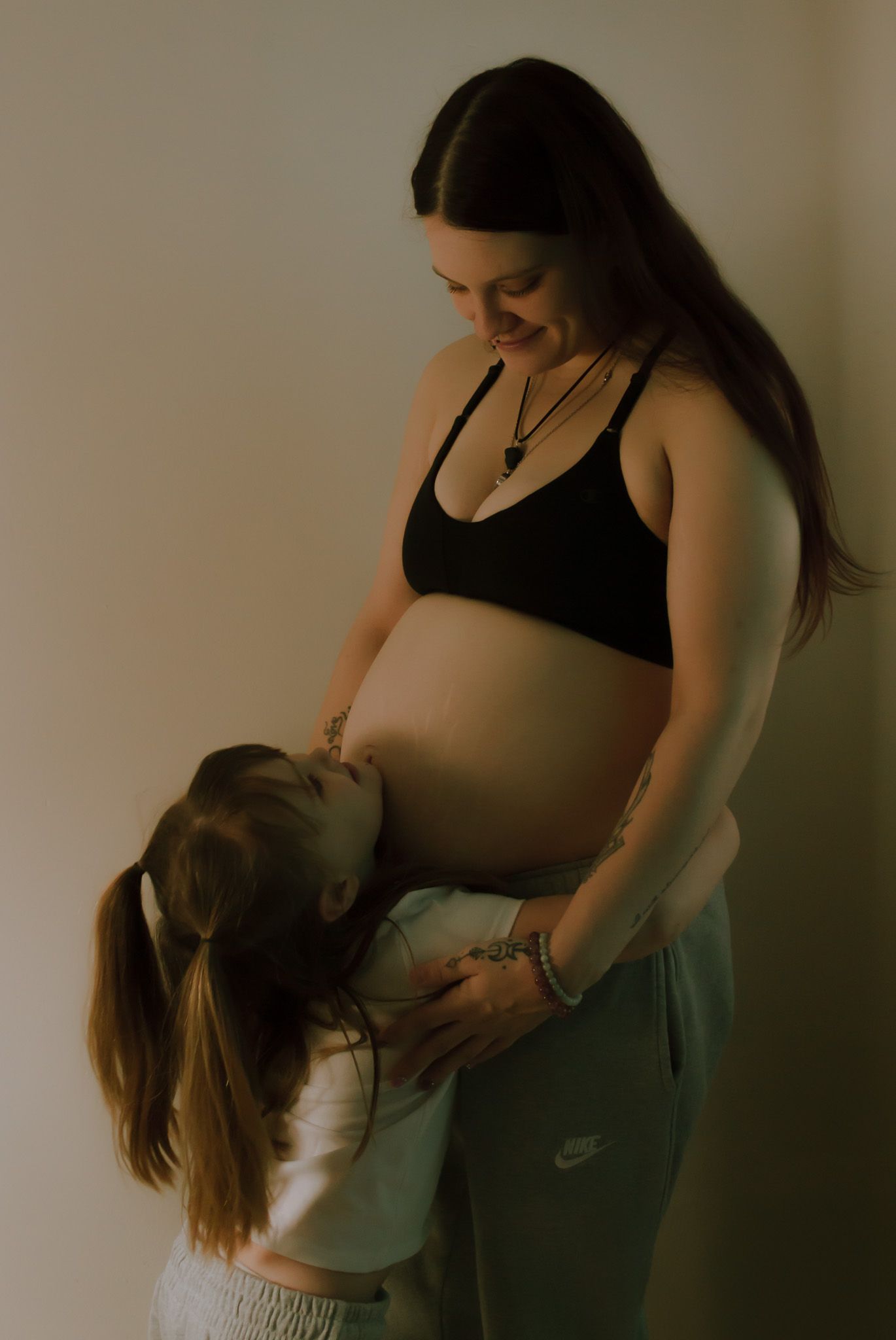 A series of intimate lifestyle portraits captured in soft, moody indoor lighting.