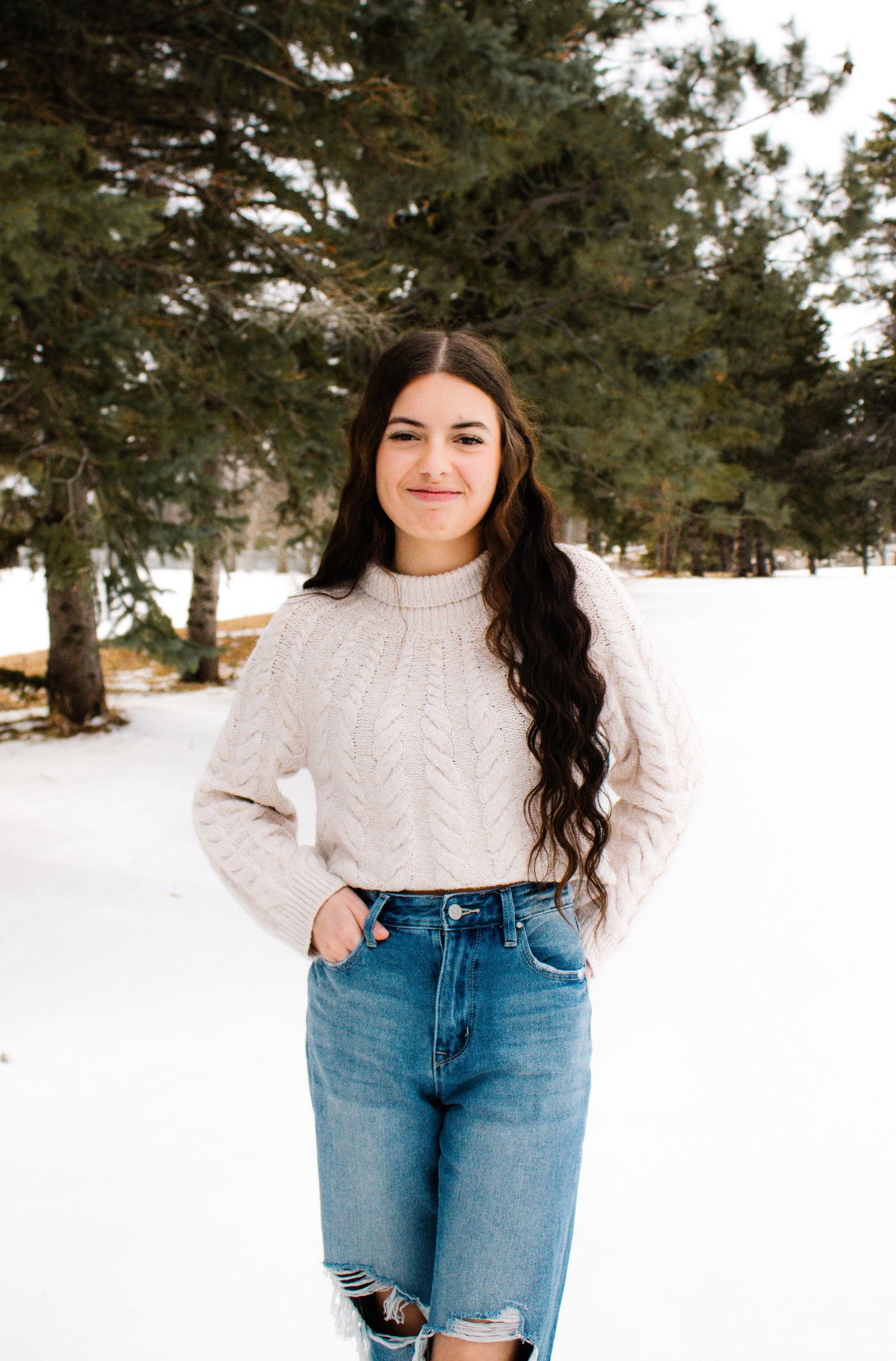 Winter fashion photography sequence with casual styling against a snowy backdrop.