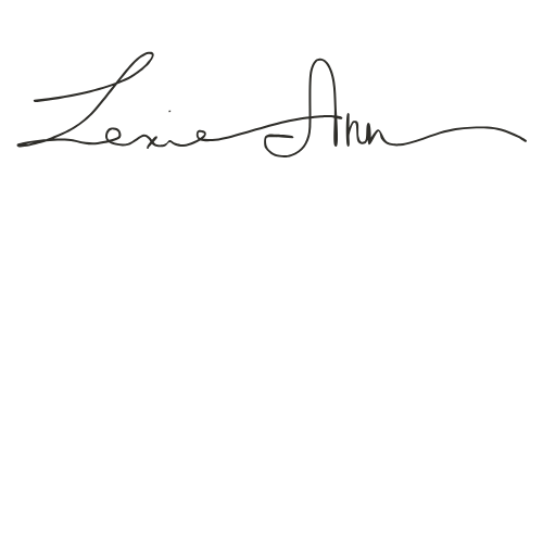 Elegant handwritten signature in black ink on white background.