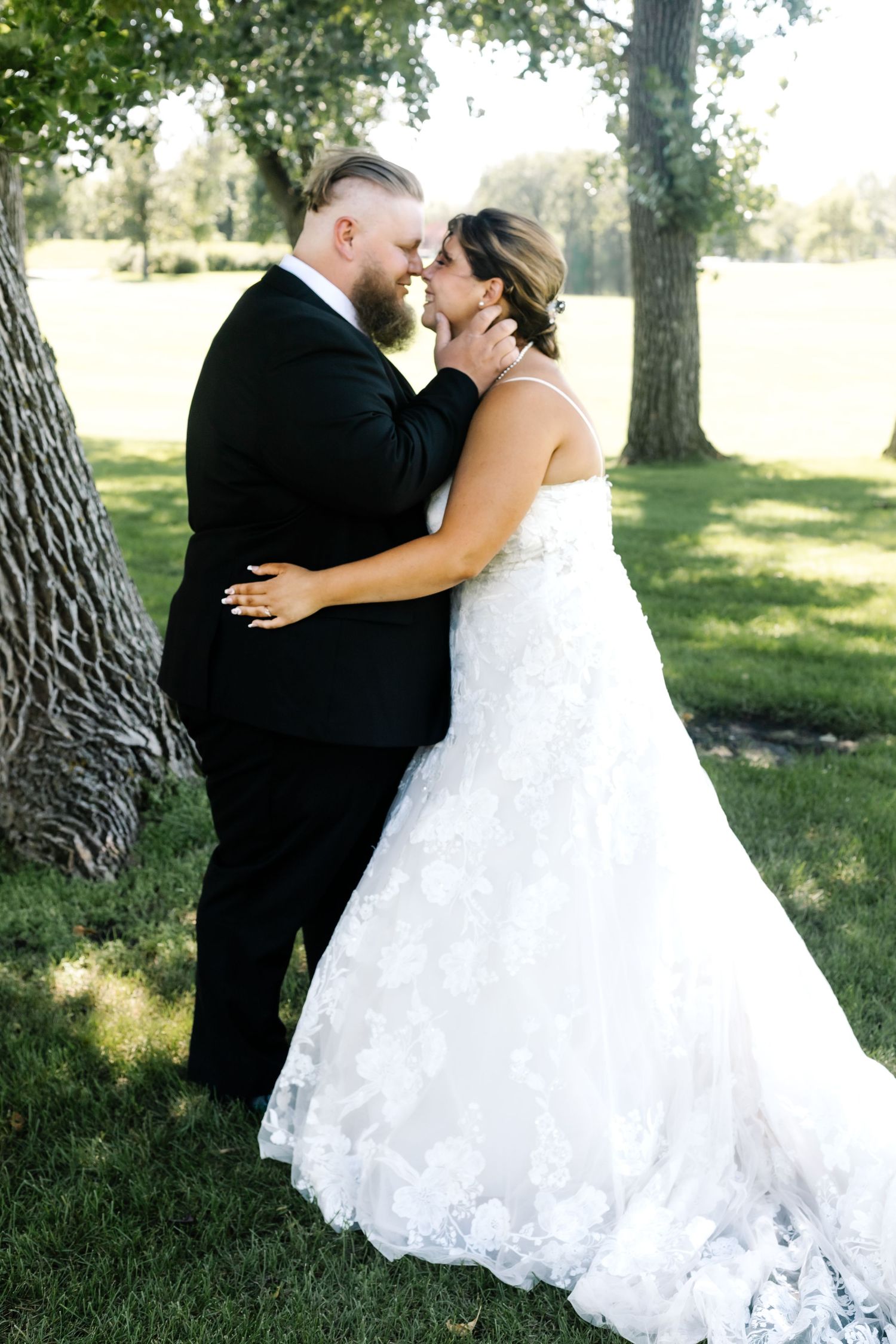 Wedding photography sequence showing romantic moments between newlyweds in an outdoor garden setting.