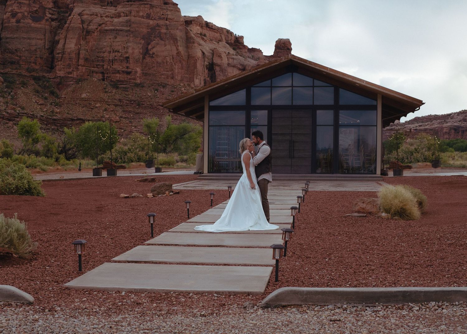 kissing in front of chapel wedding moab utah