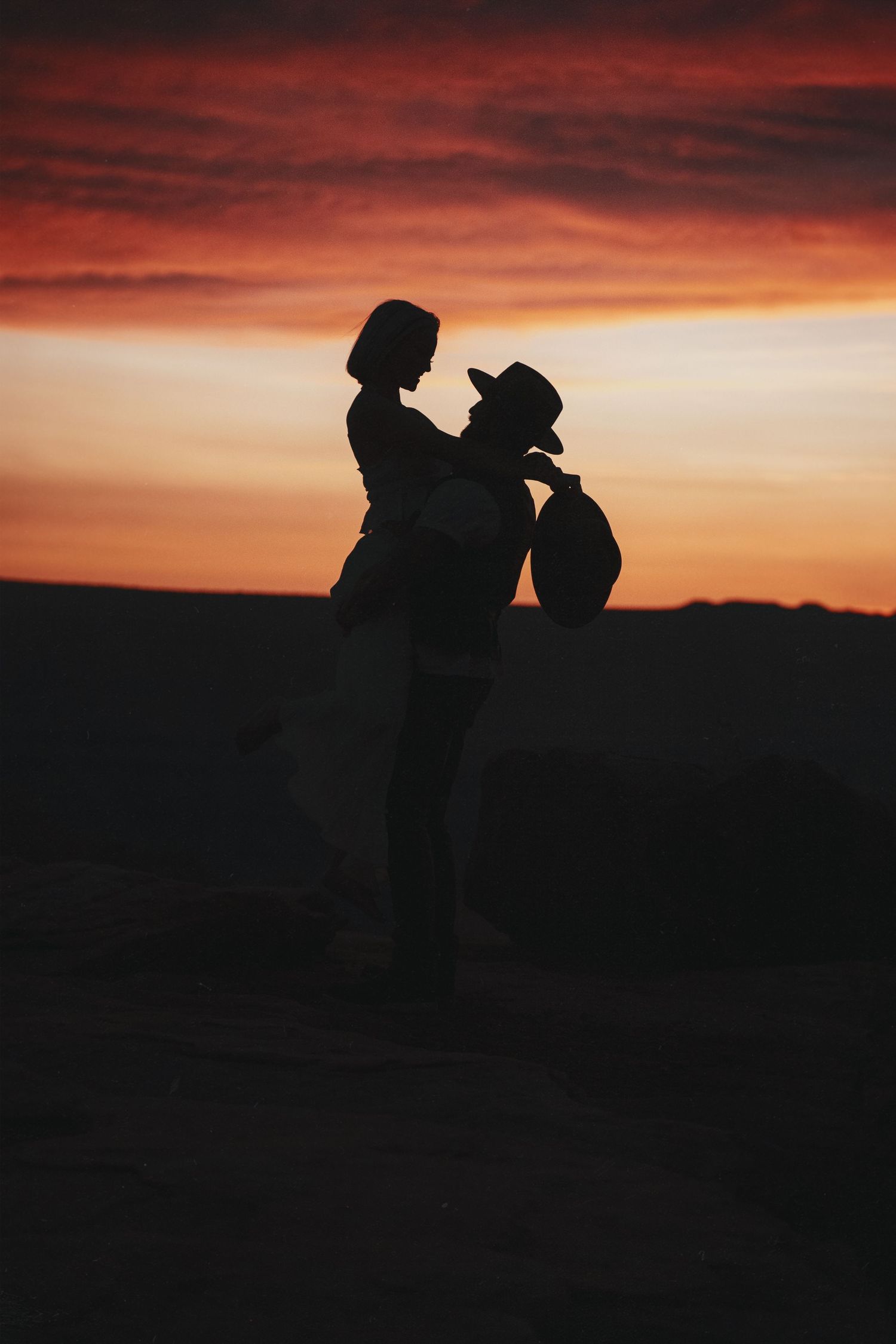 backlit sunset photo of couple
