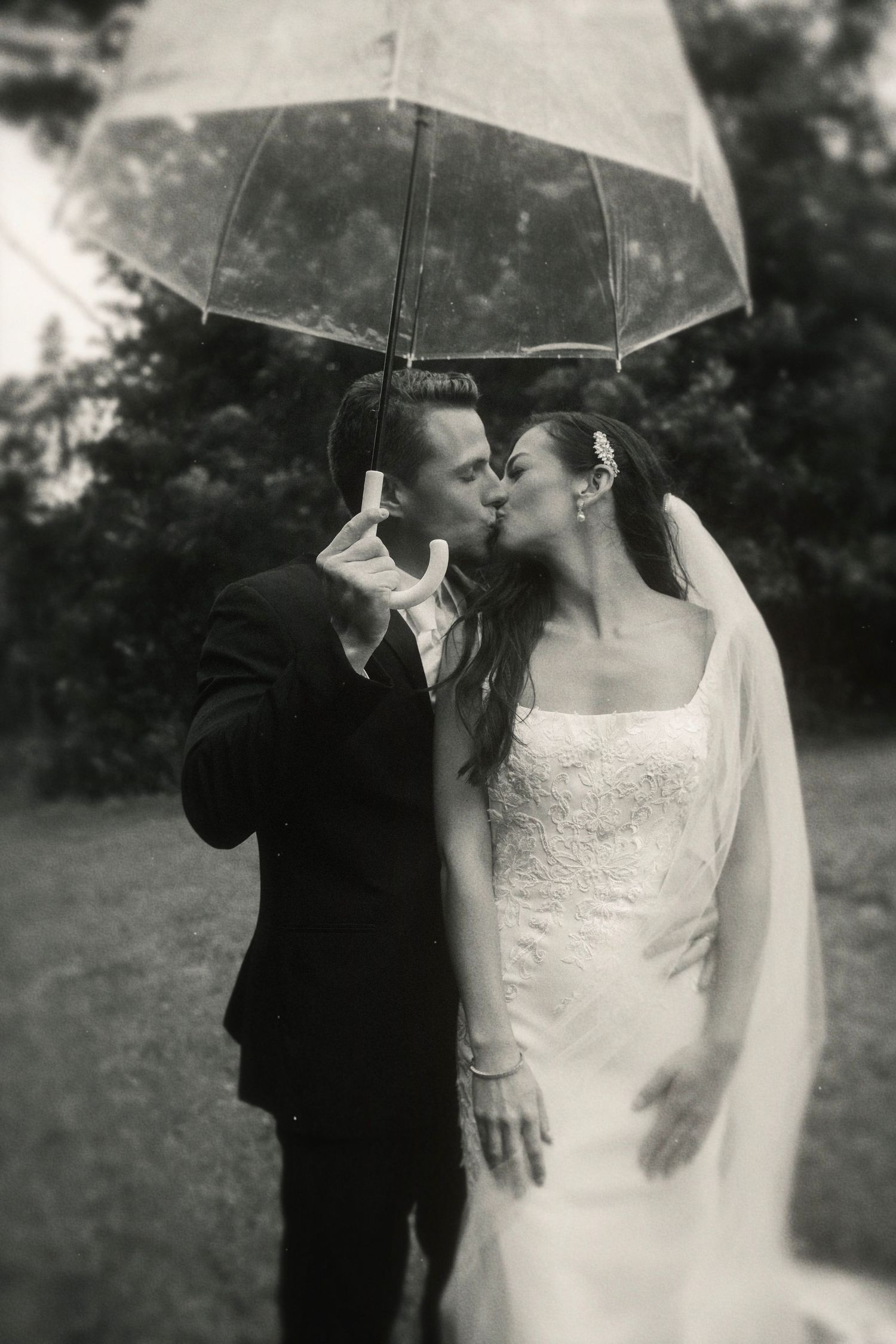 couple wedding bride umbrella kissing