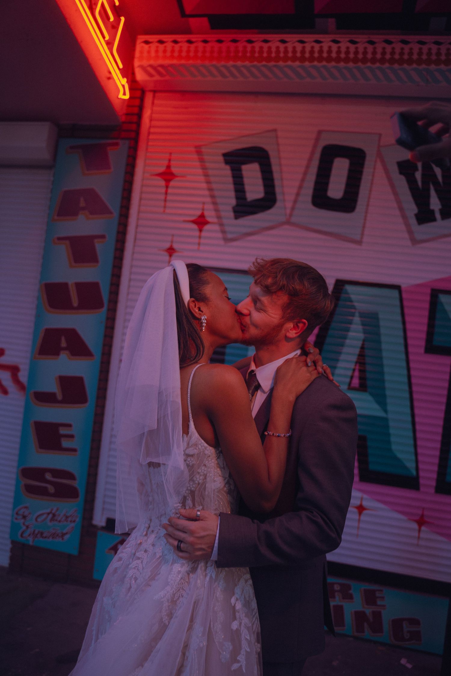 interracial couple kissing outside las vegas chapel