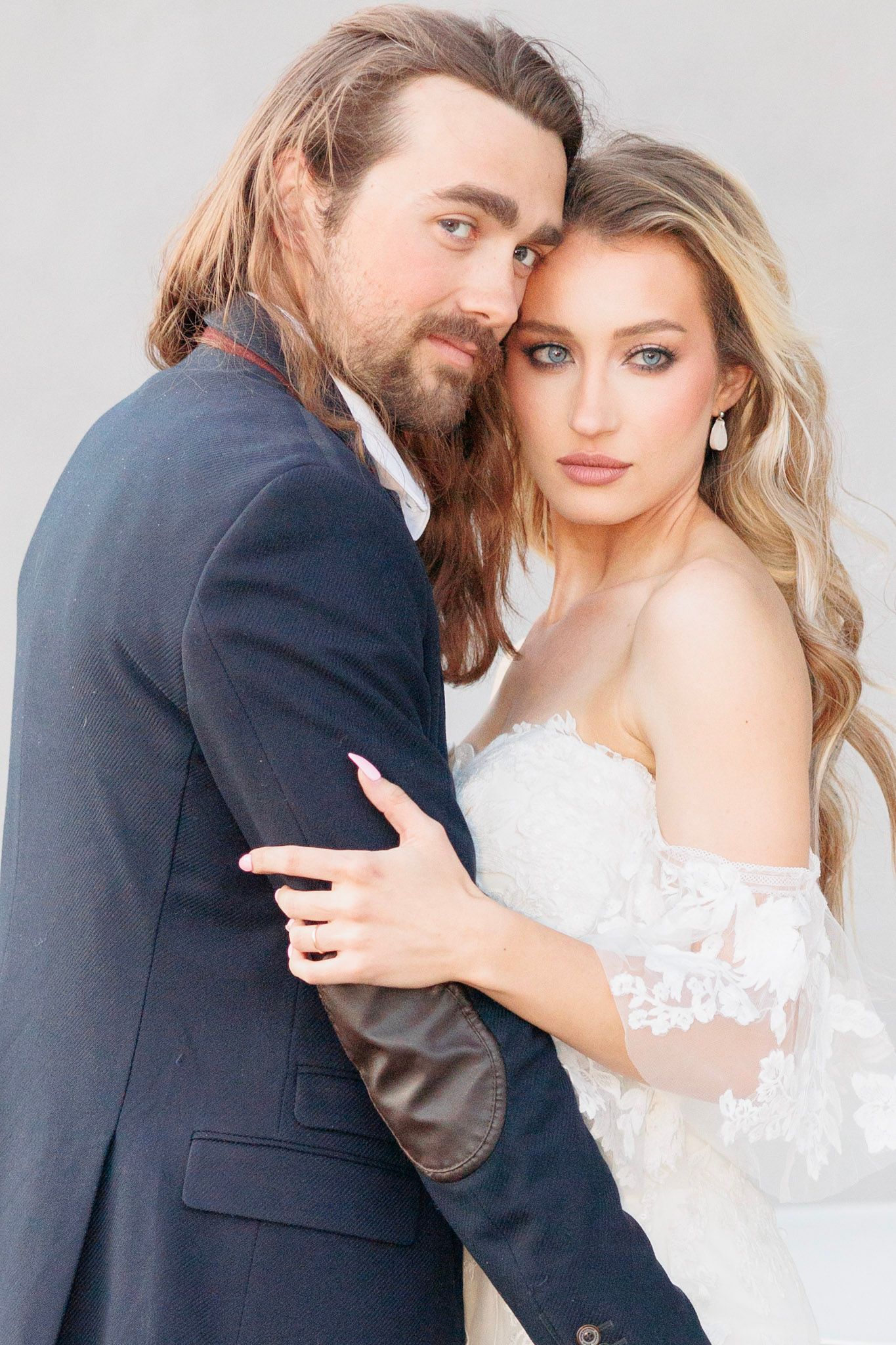 Artistic wedding portrait series capturing tender moments between newlyweds.