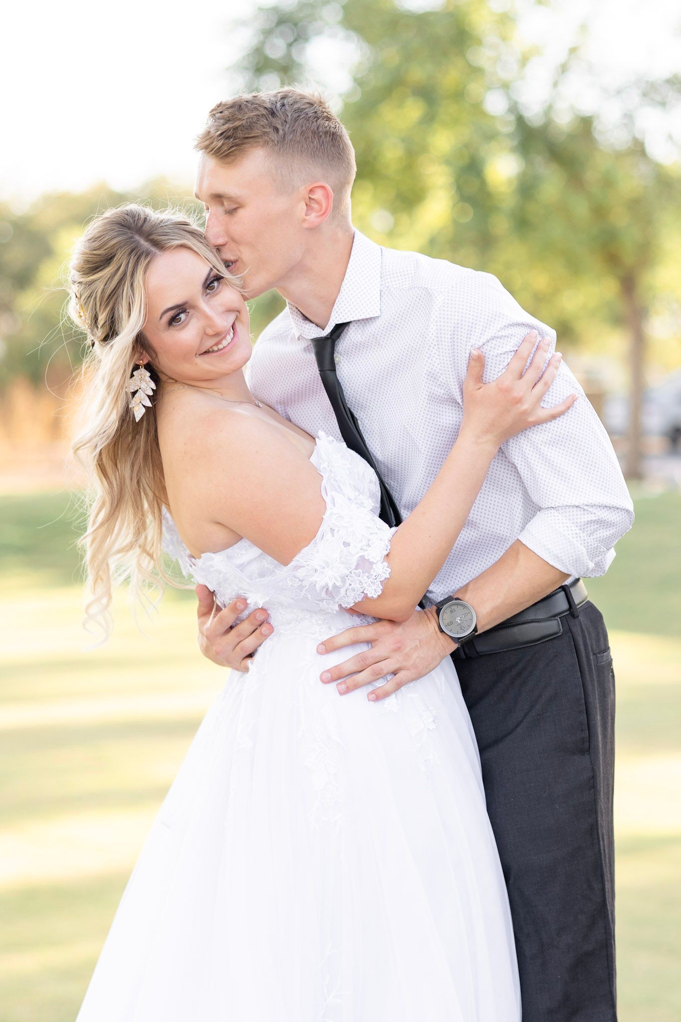 Romantic outdoor wedding portraits captured in golden afternoon light.