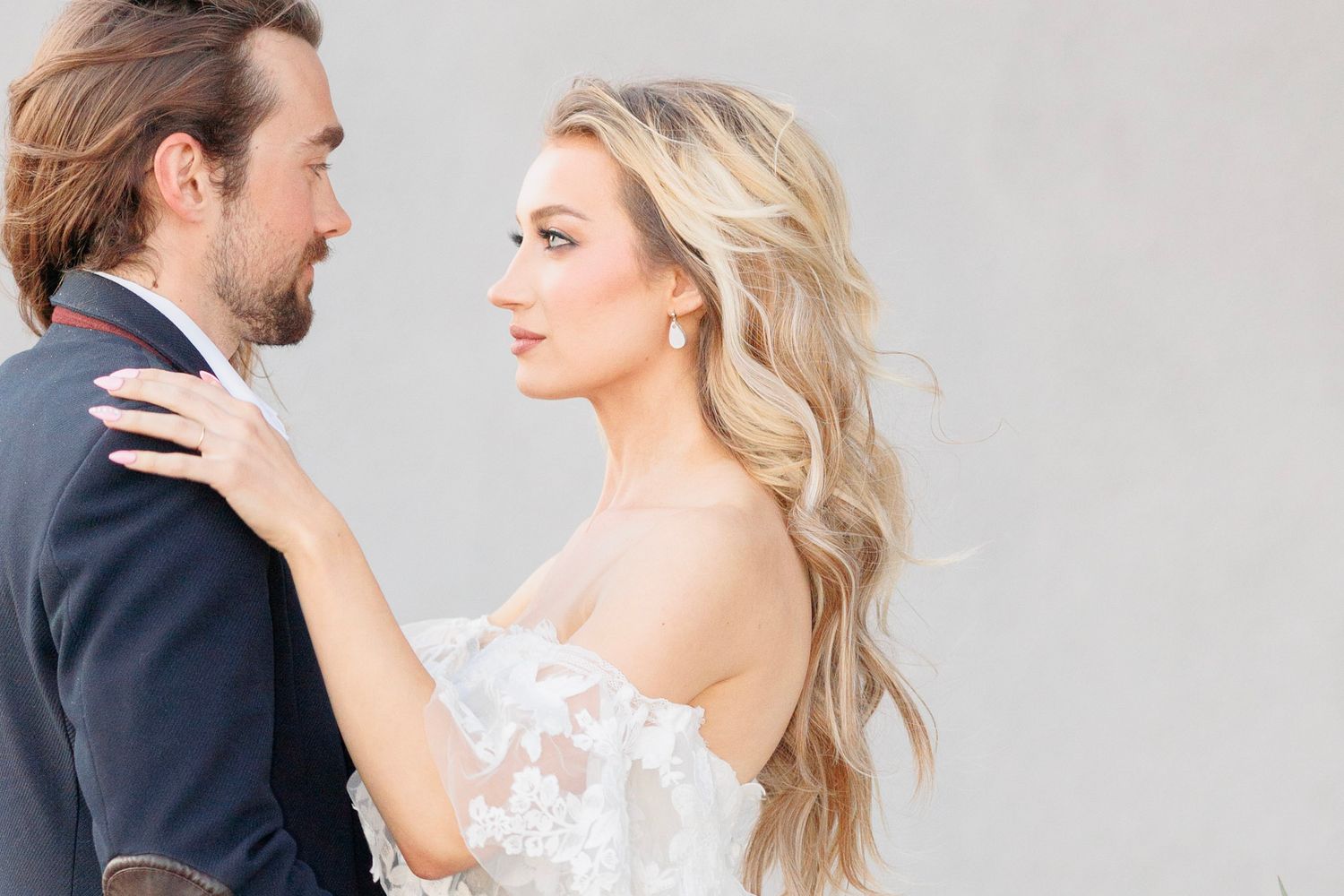 Intimate wedding portrait showcasing delicate lace details on bridal gown.