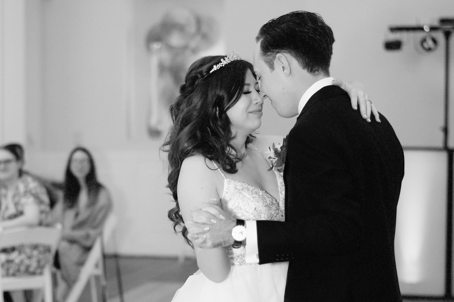 Black and white photos show couple sharing intimate dance moves.