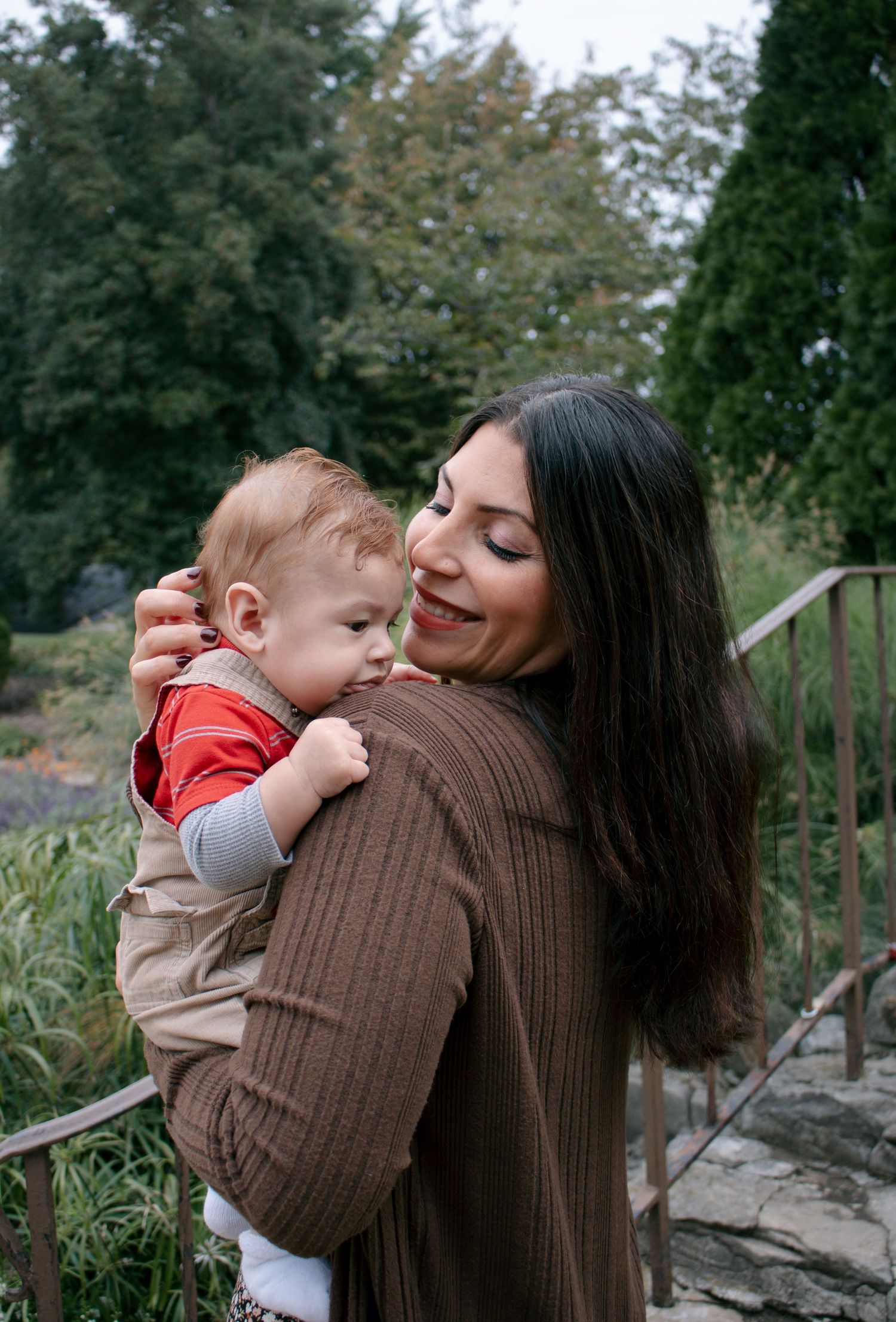 Sweet moments between parent and child captured in an outdoor setting.