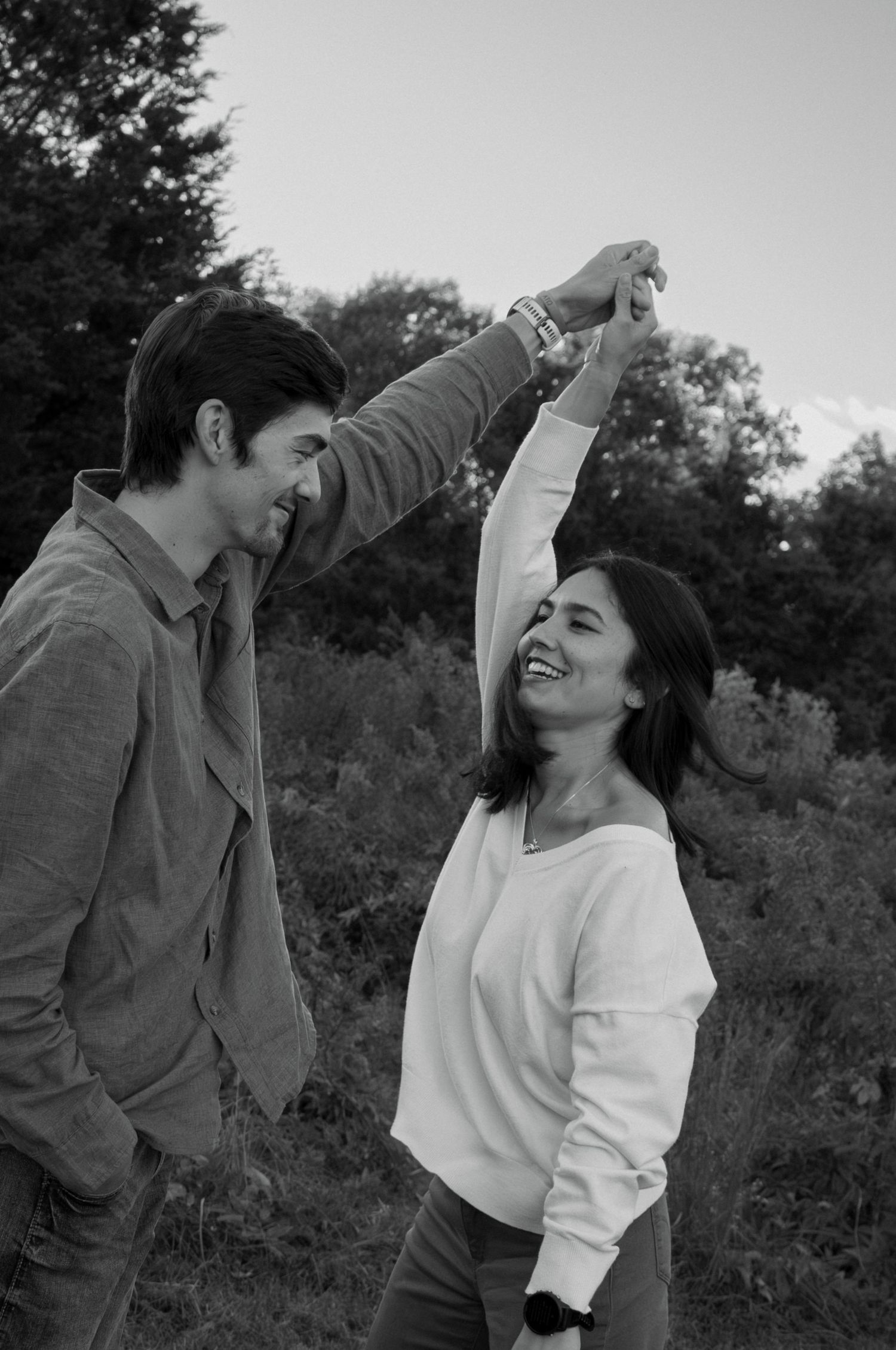 Black and white dance sequence photos in outdoor natural setting.