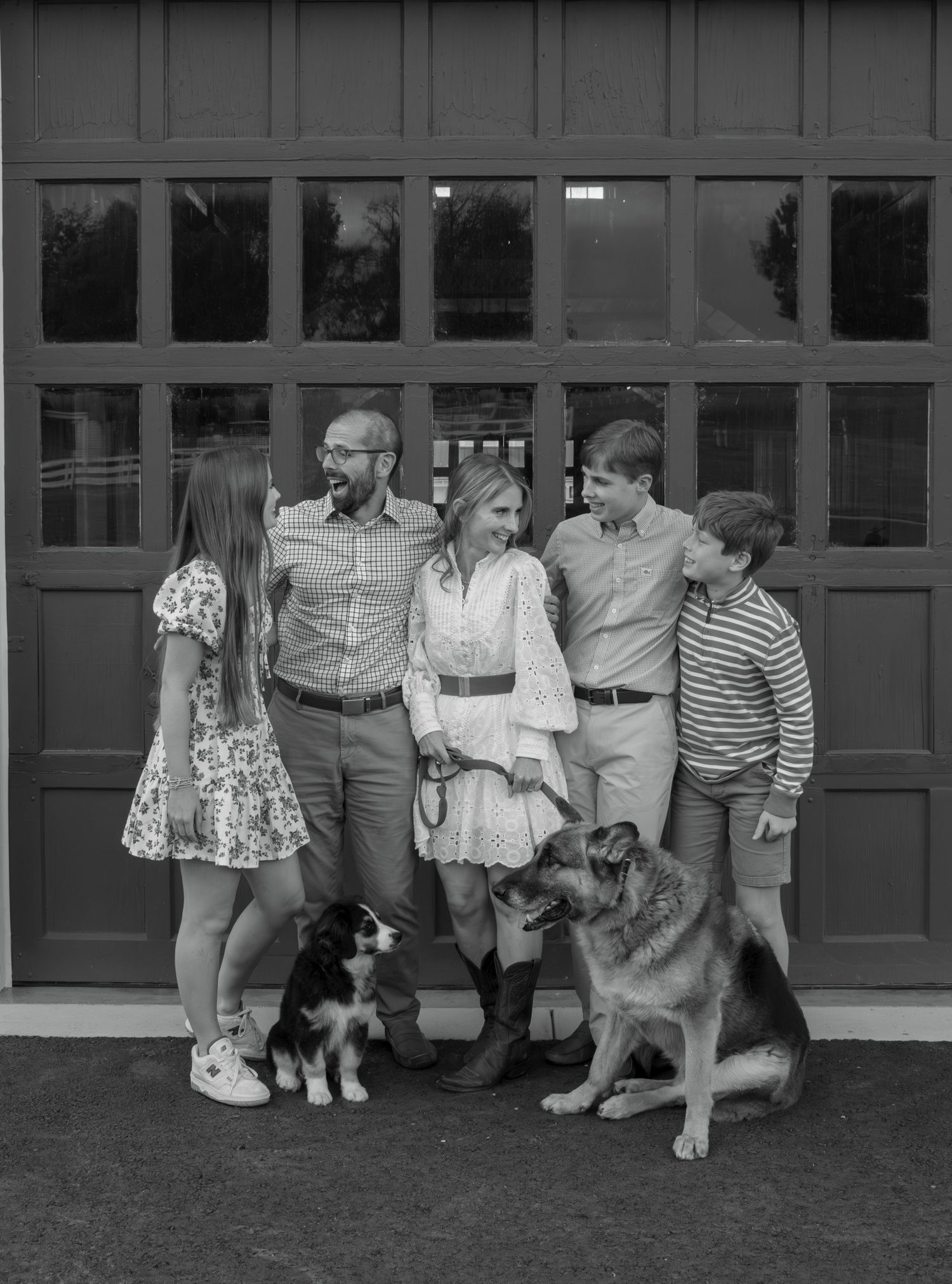 A sequence of vintage black and white photographs showing people and pets lined up against a wall.
